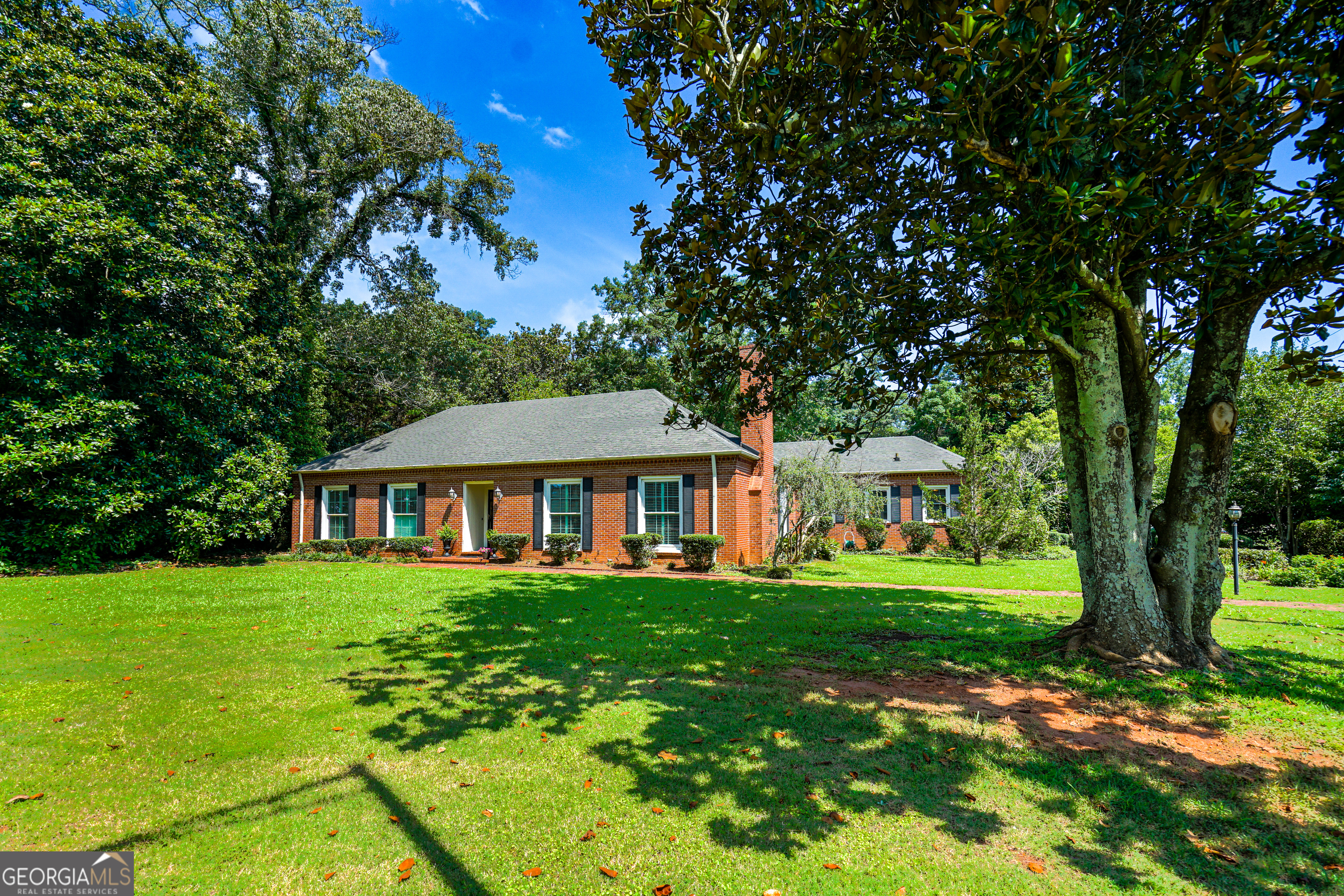 This beautifully crafted all-brick home offers a rare combination of charm, quality construction, and everyday convenience. With four spacious bedrooms and three full bathrooms, there's plenty of room to spread out - with entertaining guests or just trying to avoid sharing the remote. Step outside, and you're greeted by your very own outdoor paradise. The private backyard features a sparkling pool and hot tub, ideal for summer fun or simply escaping the noise of the day. The fully equipped pool house convenience, whether you're hosting backyard BBQs or just drying off after a swim. Set on a sizable lot with plenty of green space, this home is as inviting on the outside as it is inside. The room generously sized, offering both comfort and functionality, while thoughtful craftsmanship can be seen in every corner. From the custom woodwork to smart layout choices, the design speaks volumes without shouting. Located in a premier area close to everything you might need, this home puts you mere moments away from everyday essentials and local treasures. Walk the kids to LaGrange Academy, grab groceries less than a mile away, or enjoy the fresh air at nearby Callaway Park. This property proves that you don't have to compromise-be it fun, function, or fantastic location. If you're ready to dive into your next chapter (literally & figuratively), this home just might be the perfect fit.
