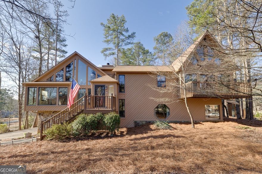 What a fantastic home in a great location! Close to shopping, dining, Merchants Walk, trails, and downtown Roswell. This large contemporary home has been well maintained with plenty of space to spread out. You will love all the natural light that comes in through the windows. As you walk in you will notice the slate floors in the entryway that leads you to the living room featuring a two-story stone wood-burning fireplace. Off to your left is a dining area and an eat-in kitchen. Enjoy your morning coffee with the screened-in deck off the kitchen. The upper level has 3 large bedrooms and 2 full baths. There is a den/game room space on the upper level that's perfect for family time. The primary bedroom features his and her closets, a deck, and a set of stairs that leads you up to your own private spa! The primary bathroom has double sinks and a shower. The lower level has brand new LVP flooring and has an extra large room for a family room, recreation room or you could even be used as a 4th bedroom. The lower level also has a full bathroom and a laundry room. There is a laundry shoot from the upper level to the lower level. The garage is extra deep to fit your cars and all of your other toys! The big lot, mature landscaping, and plenty of trees that makes it feel like you are far away from a city, yet you are right down the road from everything you may need. Original owners! Enjoy the bounty of decades of thoughtful care with the landscaping. There is an OPTIONAL swim/tennis/playground HOA! You are not going to want to miss out on this home!