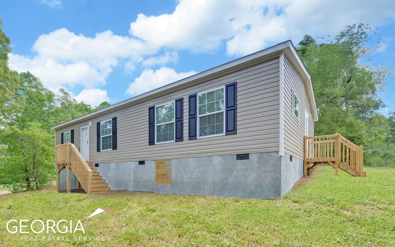 Welcome to 102 Meadowlark Lane, Toccoa, GA! This 2023 Fleetwood Double Wide is move-in ready and located just a short walk from Lake Hartwell. With 3 bedrooms and 2 full bathrooms, this home offers an open floor plan designed for modern living. The spacious kitchen features shaker-style cabinetry, stainless steel appliances, and a center island-perfect for entertaining. Plank flooring flows throughout the home, creating a sleek and cohesive look. Both bathrooms are spa-inspired and generously sized. Home is on a permanent foundation and qualifies for financing. Community boat launch access makes lake days a breeze. If you're looking for affordable, stylish lake living in a quiet setting, this is it!