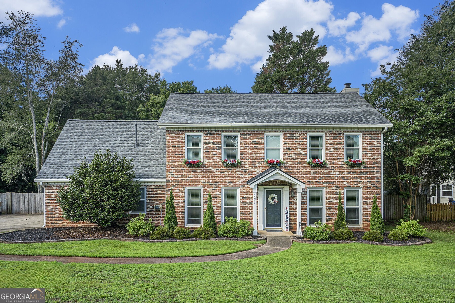 Brick-Front Traditional in Prime East Cobb Location! Nestled on a Quiet, Tree-Lined Street in the Highly Desirable Kell School District, this Move-In Ready Home offers the perfect blend of Comfort, Convenience, and Charm. Located in Lakewood Colony and just minutes from Highway 92, I-75, Downtown Woodstock, Shopping, and Dining, the location simply can't be beat. Inside, enjoy All-New Flooring on the Main Level and an Open Floorplan featuring a Fireside Family Room with Built-Ins and Ample Storage, a Spacious Dining Room, and an Updated Kitchen outfitted with Quartz Counters, Stylish Cabinets, and Stainless Steel Appliances. A convenient Half Bathroom completes the main floor. Upstairs, the Primary Bedroom offers a Walk-In Closet and a Private Ensuite with Dual Sinks and a Large Shower. Three Additional Bedrooms share a Hall Bathroom, providing flexible space for guests, a home office, or a playroom. Outside, enjoy a Fully Fenced, Flat Backyard perfect for entertaining complete with a Spacious Patio and a Firepit. With All-New Plumbing Throughout the Home and its unbeatable location, this one truly checks all the boxes!
