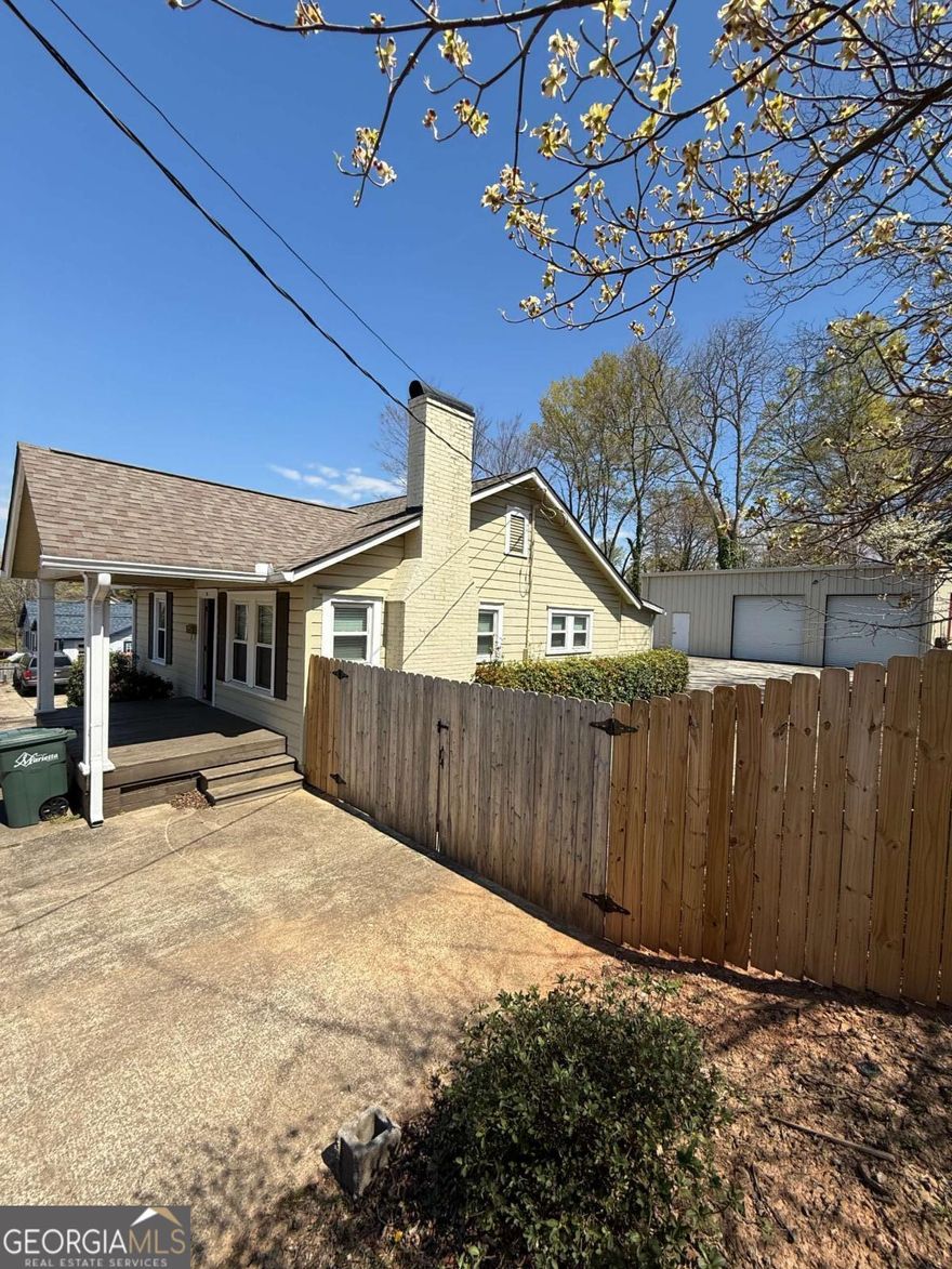 Renovated property has 2 building on one lot. Front building used as a professional office. Free standing industrial warehouse in the back at 1,300 sq ft & 15' ceiling height. Fenced and gated. Parking lot for multiple vehicles.
