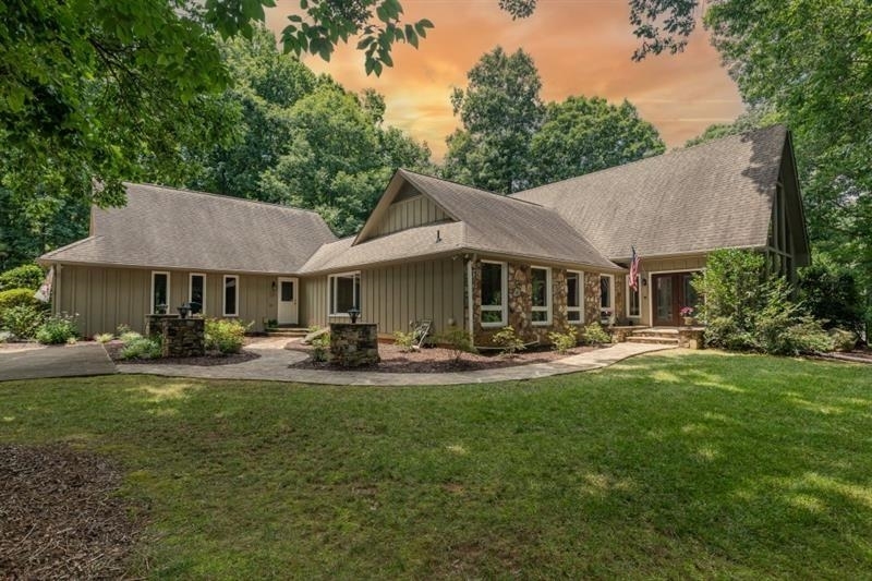 Imagine liv in 1.1acre 6bed 5fullbath &2half bath culdesac home in pop Wheeler dist.Step into 2story foyer &b greeted by dramat flr to ceiling windows overlooking side yard.As u walk under 2ndstory hallway note beautiful iron balustrs &hardwd flrs lead u into dram 2storyGRANDrm.This beaut rm will win u over w/a2story stonefireplace flank by flr to ceiling windws overlooking backyd &dramatic vaulted/beamd ceil.Imagine waking up in ovrsized msteronmain&direct stepping out unto ur XLdeck to enjoy sounds of nature &hummingbirds flying by.Maybe u will hear the sm creek in back or choose to walk on bridge crossing it.After the fresh air enjoy a drink in ur beaut painted kitch w/XL windws overlooking front courtyrd.Note stonecounters breakbar dinarea dblovens microw refrig lgpntry disp trashcomp &dishwasher.