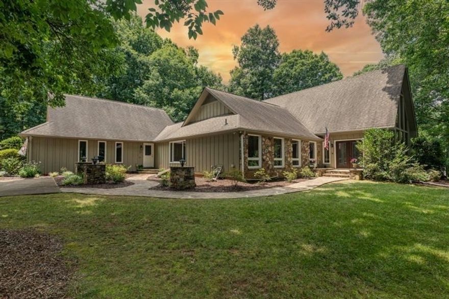 Imagine liv in 1.1acre 6bed 5fullbath &2half bath culdesac home in pop Wheeler dist.Step into 2story foyer &b greeted by dramat flr to ceiling windows overlooking side yard.As u walk under 2ndstory hallway note beautiful iron balustrs &hardwd flrs lead u into dram 2storyGRANDrm.This beaut rm will win u over w/a2story stonefireplace flank by flr to ceiling windws overlooking backyd &dramatic vaulted/beamd ceil.Imagine waking up in ovrsized msteronmain&direct stepping out unto ur XLdeck to enjoy sounds of nature &hummingbirds flying by.Maybe u will hear the sm creek in back or choose to walk on bridge crossing it.After the fresh air enjoy a drink in ur beaut painted kitch w/XL windws overlooking front courtyrd.Note stonecounters breakbar dinarea dblovens microw refrig lgpntry disp trashcomp &dishwasher.