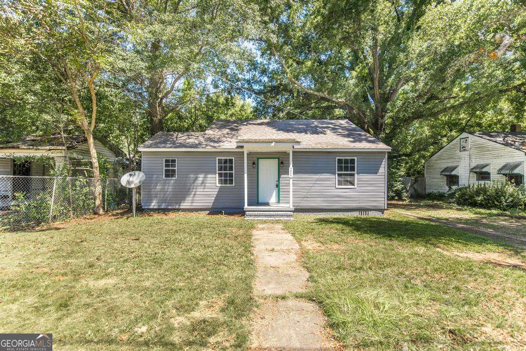 This one-story home sits on a spacious lot in a well-established neighborhood with no rear neighbors. The layout includes a large living area with high ceilings and great natural light, as well as a dedicated dining space and galley-style kitchen. One of the standout features is a vintage mother-in-law suite located at the back of the home-while not recently renovated, the seller notes the foundation is solid and the space offers potential for future use or customization. The oversized backyard provides plenty of room for gardening, entertaining, or relaxing in privacy. Enjoy convenient access to major roadways, dining, and shopping nearby.