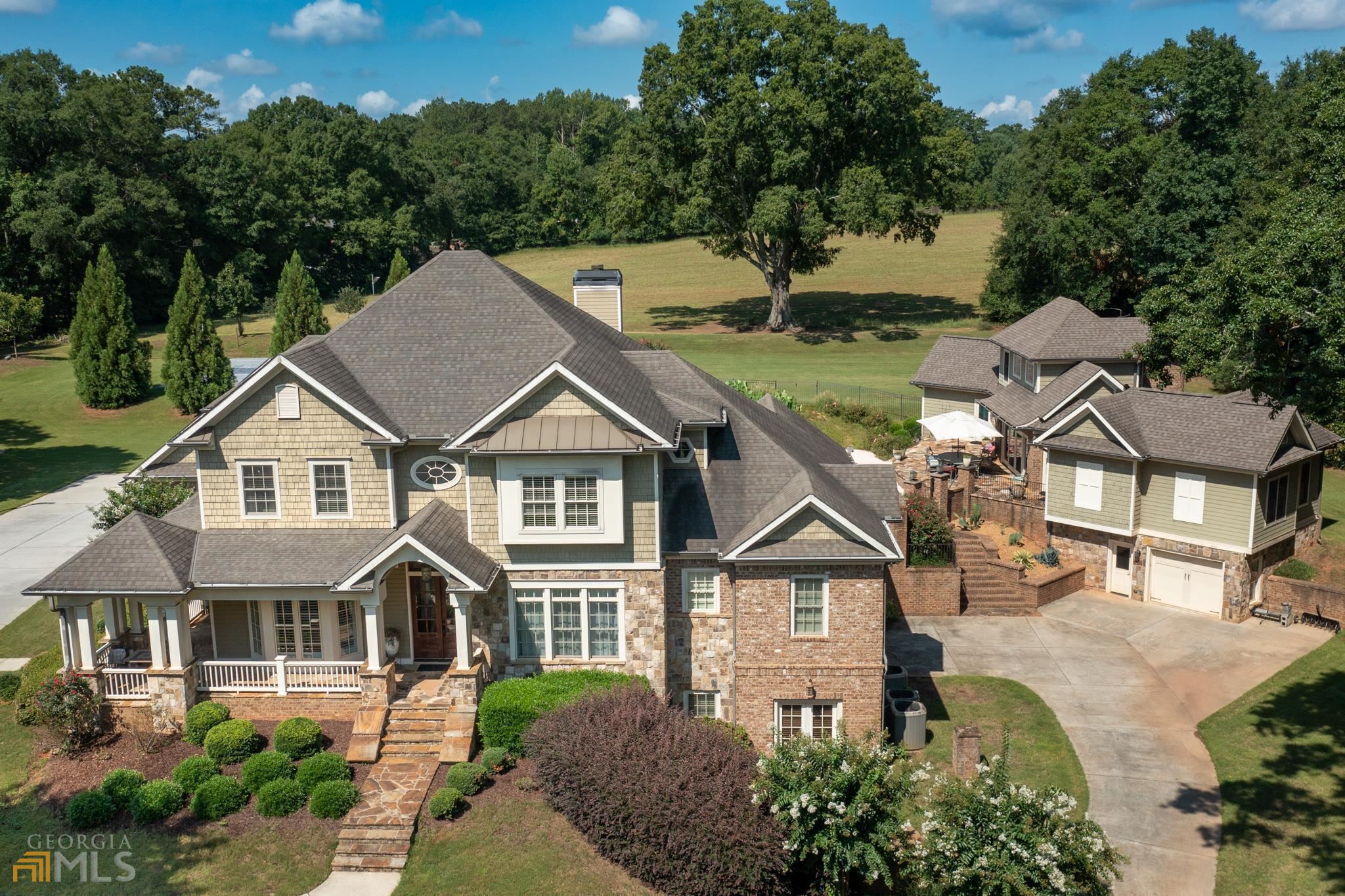 Reduced by $251,000 .  Must See,  Magnificent Private Estate Home With Resort Feel In The Sought After Whitewater School District. Full Size Basketball Court With Benches, Resort Style Gunite Heated Salt water Pool With Waterfall And Seating Under The Waterfall. Built In Rock Slide, Diving Board, Outdoor Full Kitchen, Pool House And Guest House. Cool Deck And Large Patio With Covered Rear Patio. Main House Is 4 Sides Brick And Stone, Was Once A Builders Personal Home With Every Attention To Detail And Quality. Entire Property is 6 Bedrooms 8 Full Baths And 4 Half Baths. Hardwood Floors Throughout The Main Level, Large Family Room With Built Ins And Fireplace, Office, Music Room ,Dining Room. Kitchen Has A Fireplace also. Kitchen Boasts Granite Counter Tops, SS Appliances, Island, Double Ovens And Professional Wolf Gas Cook Top With Pot Filler. Large Walk in pantry, Mud Room / Laundry Room That Has A Dog Washing Station. Lots Of Custom Cabinets. Kitchen Office and Friends Entrance. 2 Half Baths On Main Level. Master Bedroom Is On The Main And Offers A Luxurious Master Bath With Multi Jet Walk In Tiled Shower And Soaking Tub. Large Walk In Closet. Upstairs Offers 3 Bedrooms And 3 Full Baths And A Bonus Room That could Be a 4th Bedroom. Full Finished Basement Offers 2620 Sq Ft Of Finished Space Offering A 15 Seat High End Theater. All Seating , Speakers And Equipment Staying, A Bedroom And A Full Bath, A Half Bath, Game Room, Family Room. Craft/ Sewing Room And Much More. Also Has A Separate Garage. Guest House Is A Full Apartment With Living Room, Kitchenette, Bedroom, Full Bath And Laundry. This is Connected To The Pool House That Has Sliding Doors To Open It Up To The Pool. Pool House Has His and Hers Full Baths, Changing Room, Party Room With Kitchenette, Gym, A Large Loft and laundry. Total Of 4 Car Garages 2.38 Acre Private Cul De Sac Lot Across The Street From Lake Horton And Close To Lake Horton Park With Boat Ramp, Walking Trails and More. Square Footage Is Not accurate in Tax Records. Square Footage Is Correct In MLS.
