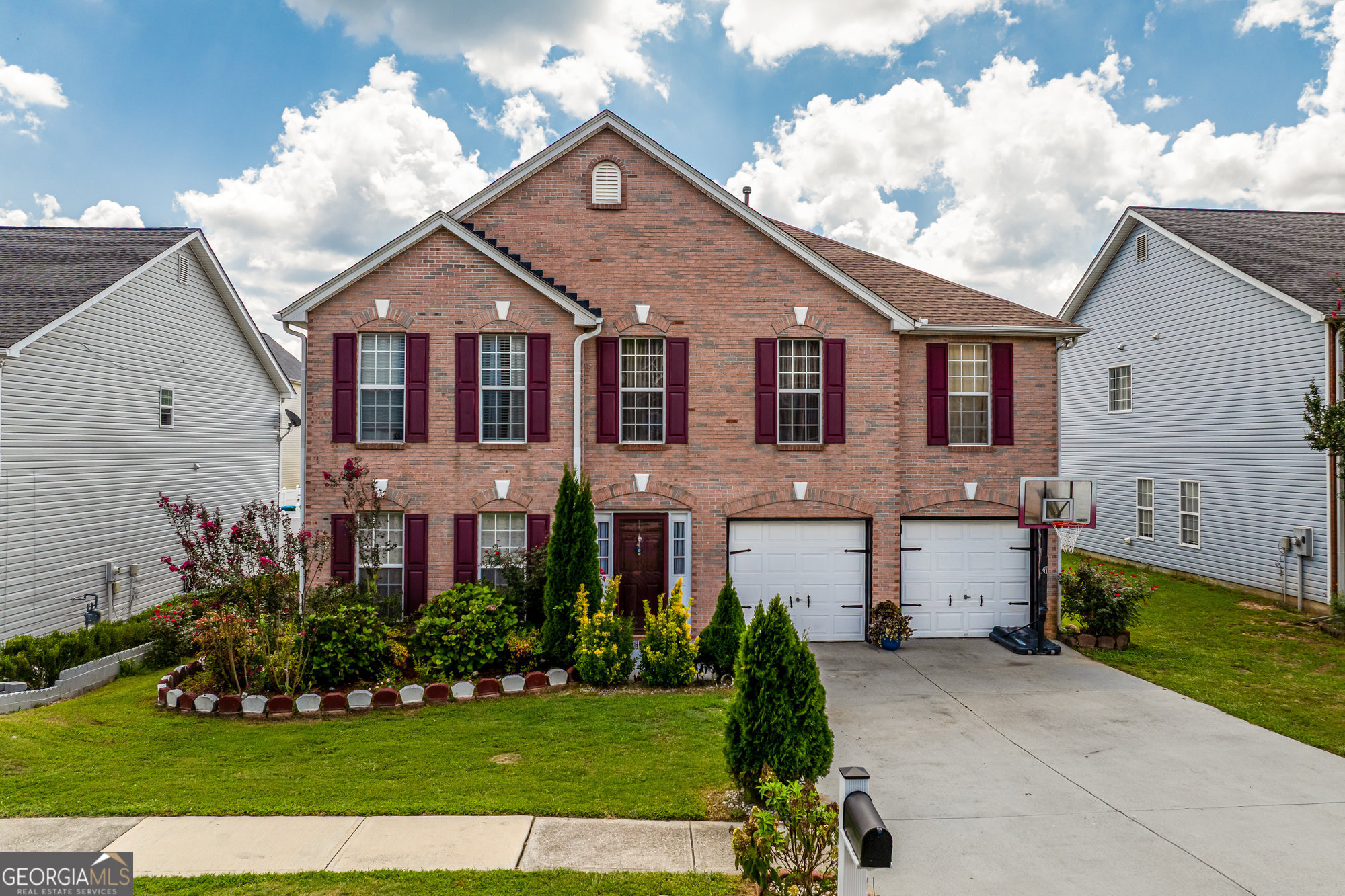 Welcome to this stunning two-story home in the sought-after Preserve at Parkwood. The inviting brick facade, manicured landscaping, new HVAC and a roof less than three years old set the tone for the well-maintained interior. Step inside to find gleaming hardwood floors that flow through the welcoming living room and separate dining area. The open-concept kitchen and great room provide the perfect space for entertaining, complete with upgraded appliances, generous counter space, and a convenient powder room for guests. Upstairs, discover five spacious bedrooms, including a luxurious primary suite with a private en-suite bath. The fenced backyard offers plenty of space for gardening, play, or outdoor gatherings. Located in a friendly community with sidewalks, streetlights, and a low HOA, this home is close to shopping, dining, and all the conveniences of Snellville living.