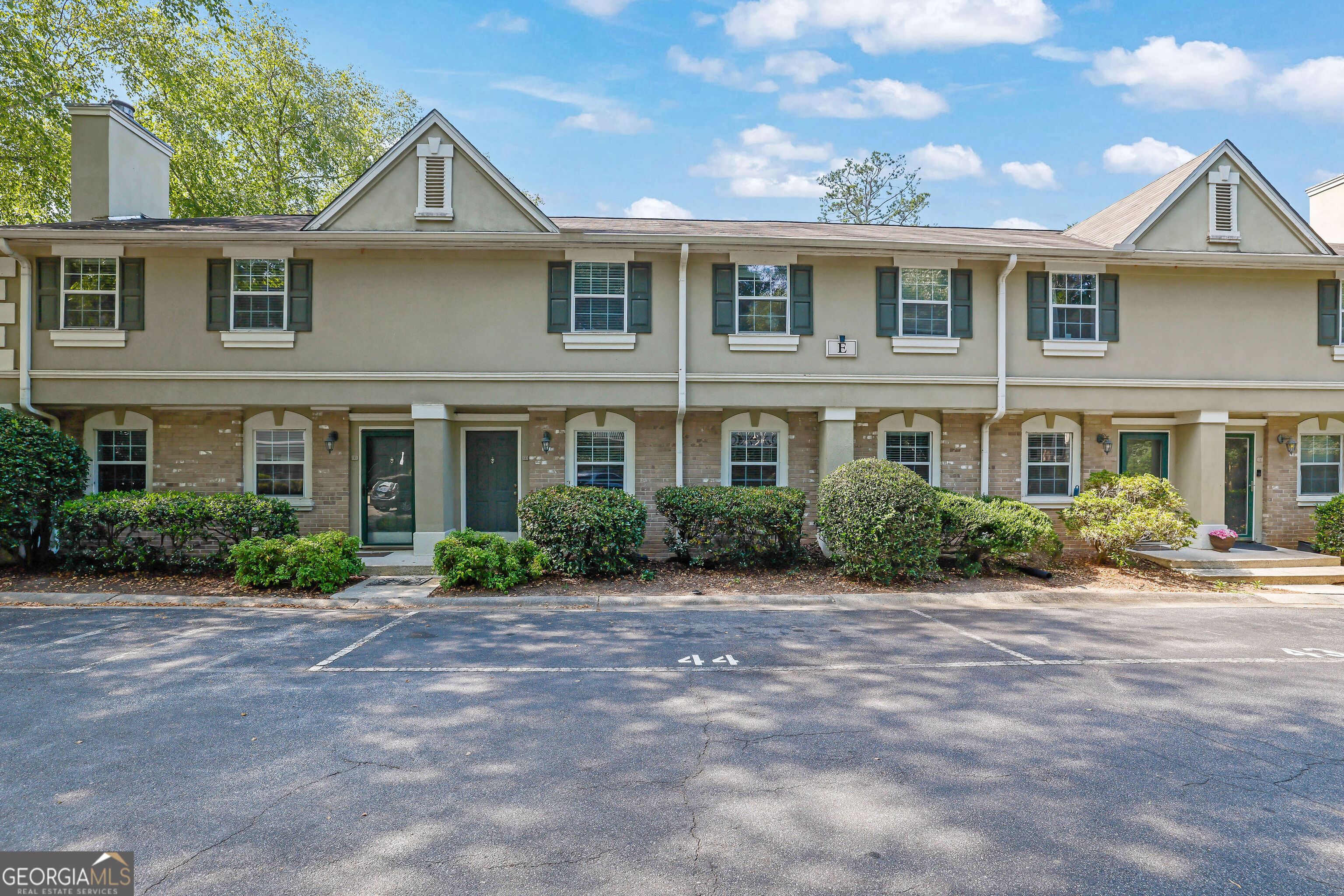 Welcome to this beautifully RENOVATED, RARE 3-level townhome-style condo in the heart of Sandy Springs! Offering nearly 2,000 sq ft of space-including a full walkout BASEMENT. Inside, enjoy brand-NEW LVP flooring, NEW fresh paint for walls and trim, updated NEW lighting fixtures, and fully RENOVATED bathrooms with modern finishes. The spacious updated modern kitchen features granite countertops and stainless steel appliances, opening to a sleek dining area-perfect for entertaining. Upstairs offers three roomy bedrooms, including a spacious primary suite with a REMODELED private bath. This rare townhouse is 1 of the few in the community with a basement! What a steal. The finished full basement adds versatile space for an office, gym, guest suite, or home theater, plus direct access to your walkout private patio and lush backyard-ideal for grilling, dining, or relaxing outdoors. Limitless opportunities and space. The Highgate at Sandy Springs is a quiet and peaceful community as you can enjoy premium HOA amenities including a swimming pool, fitness center, clubhouse, dog park, and gated security entrance-PLUS water, trash, landscaping, roof, and termite coverage. Whether you're looking for your first home or a low-maintenance lifestyle in a prime location, this townhome checks all the boxes. Drink your cup of coffee in your walkout patio or at Starbucks which is only a few blocks away. Minutes from Perimeter Mall, Trader Joe's, Whole Foods, Costco, Starbucks, Home Goods, and top dining spots-with easy access to GA-400, I-285, and MARTA. Outdoor lovers will enjoy nearby parks, trails, and the Chattahoochee River. This move-in ready remodeled home offers modern updates, unbeatable space, and a prime location. Don't miss it-schedule your tour today! This won't last long!