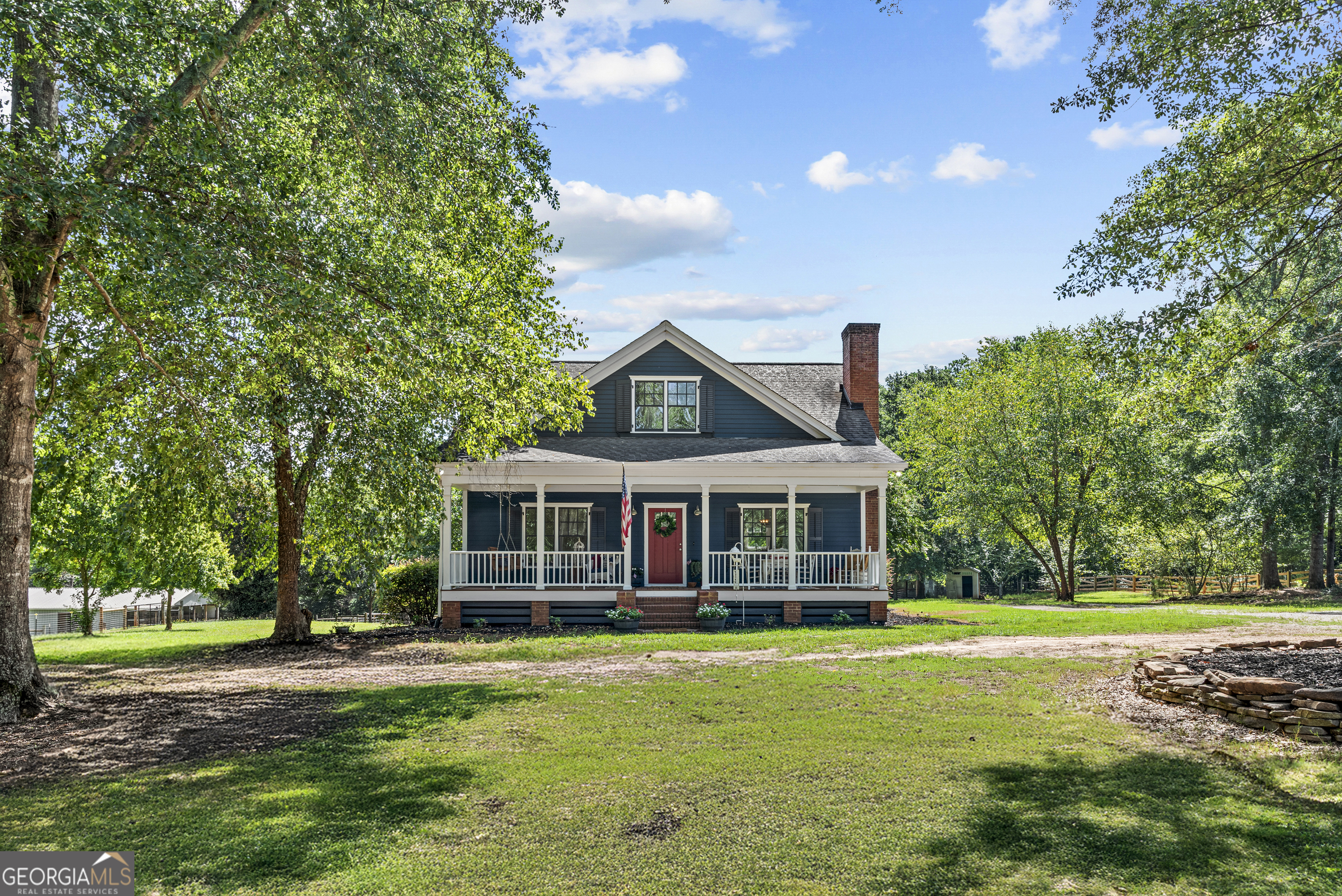 This fully fenced and crossed-fenced 5 acre farmstead offers the perfect blend of space, functionality and comfort. The home features 5 bedrooms and 4 full baths with an open, light-filled floor plan ideal for everyday living and entertaining. Stylish kitchen with granite countertops, custom cabinetry, island and stainless steel appliances. Multiple living areas and plenty of room to spread out. Two spacious bedrooms upstairs with a jack-n-Jill bath. Fully finished basement with bedroom and full bath, ideal for guests or extended family. Outside, the property is well equipped for livestock and hobby farming. The barn includes 2 horse stalls and 6 goat/sheep stalls. There are six established pastures and four run-ins, providing ample room for animals to roam. Gently rolling terrain perfect for grazing, gardening or simply soaking up the tranquility of country living.