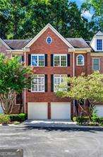 Spacious townhome nestled in a quiet, gated Brookhaven community! This 3-bedroom, 3.5-bathroom home with a 2-car garage offers a bright and inviting layout perfect for everyday living and entertaining. A 2-story foyer welcomes you with abundant natural light. The main level features a separate dining room and a kitchen with white cabinetry, stainless steel appliances, a large pantry, and views into the open family room with a cozy fireplace. Step outside to the deck and enjoy private wooded views, ideal for relaxing after dinner. Upstairs, the owner's suite boasts a spa-like ensuite with a double vanity, freestanding tub, and shower, along with a built-in walk-in closet. A secondary bedroom with its own ensuite bath and the conveniently located laundry room with storage complete the upper level. The terrace level offers a flexible space that can serve as a third bedroom, office, or media room, featuring a full bathroom and two additional closets for plenty of storage. Enjoy being within walking distance of Murphey Candler Park and close to top-rated schools, shops, and restaurants in both Brookhaven and Chamblee. Easy access to I-285, I-85, and GA-400 makes commuting a breeze.