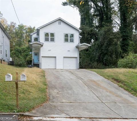 Photo of 2027 LOIS Place NW #UNIT A, Atlanta, GA 30318 (MLS # 10636520)