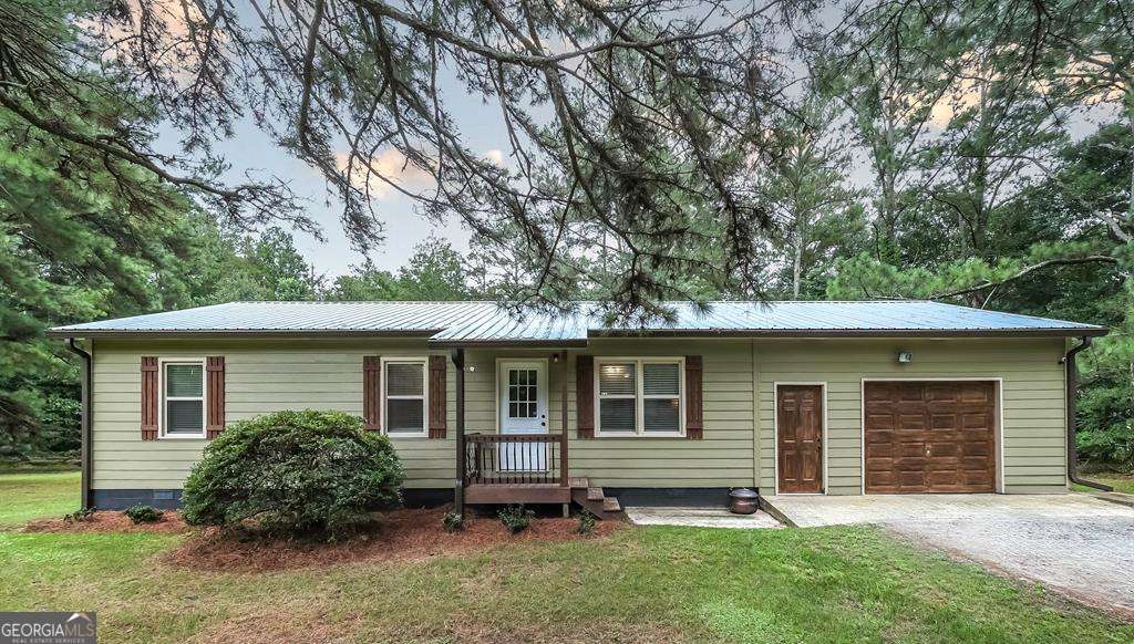 This charming home features 2 bedrooms (easily convertible back to 3) and 2 full baths, all nestled on 1.11 serene acres. With multiple storage buildings, there's plenty of room for your hobbies, tools, or even a few farm animals. Whether you're tinkering in the workshop or enjoying the quiet of country living, this cozy property has that warm, welcoming feeling that just says home!