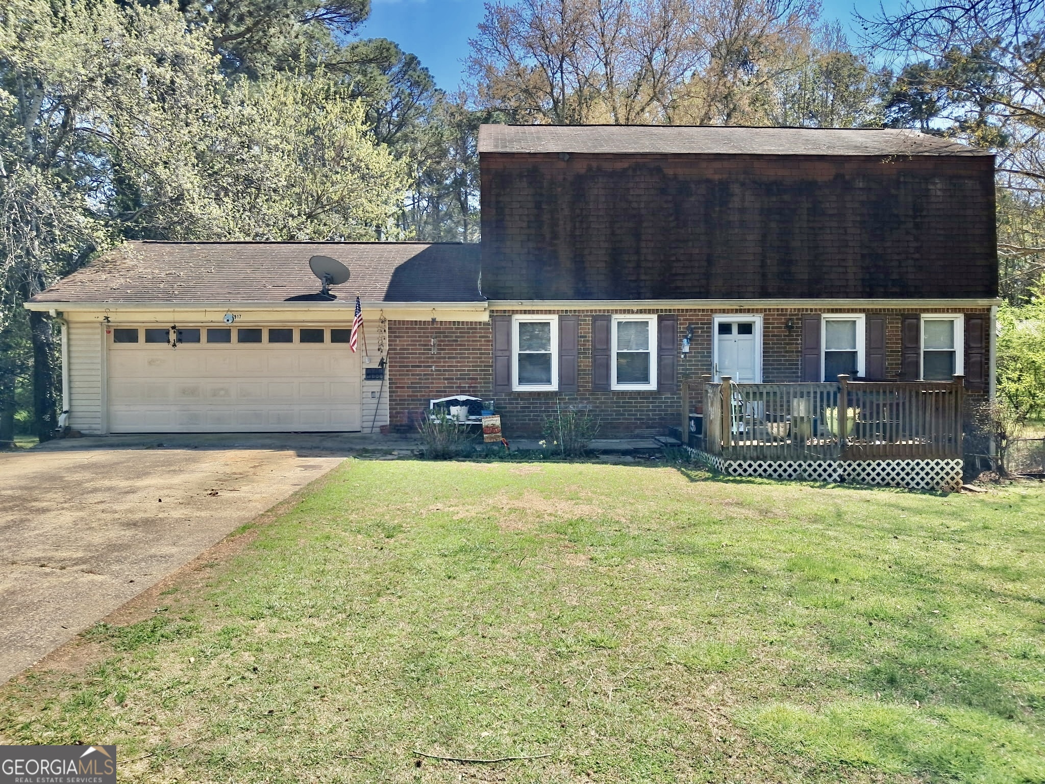 This spacious floorplan features living/dining room combo, inviting kitchen makes cooking a breeze, cozy den with half bath and storage room, 3 nice size bedrooms upstairs with 2 full baths, and a 2 car garage. The basement is a blank canvas, ready to be turned into a recreation room, workshop, or additional living space. Step into your personal oasis with the huge fenced backyard, a true haven for outdoor enthusiasts! Sprawling and private, this generous space offers endless possibilities for relaxation and recreation. With a little vision and creativity, this property can shine bright in the heart of this great location in Douglasville. No blind offers please!!