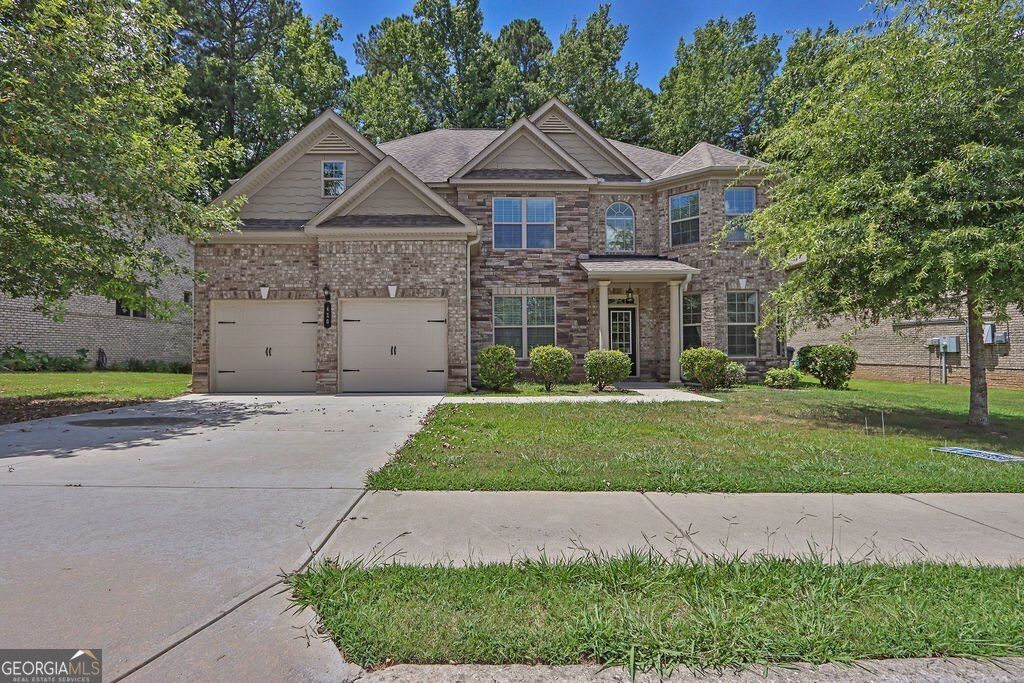 Photo of 410 Live Oak Pass, Loganville, GA 30052 (MLS # 10656736)