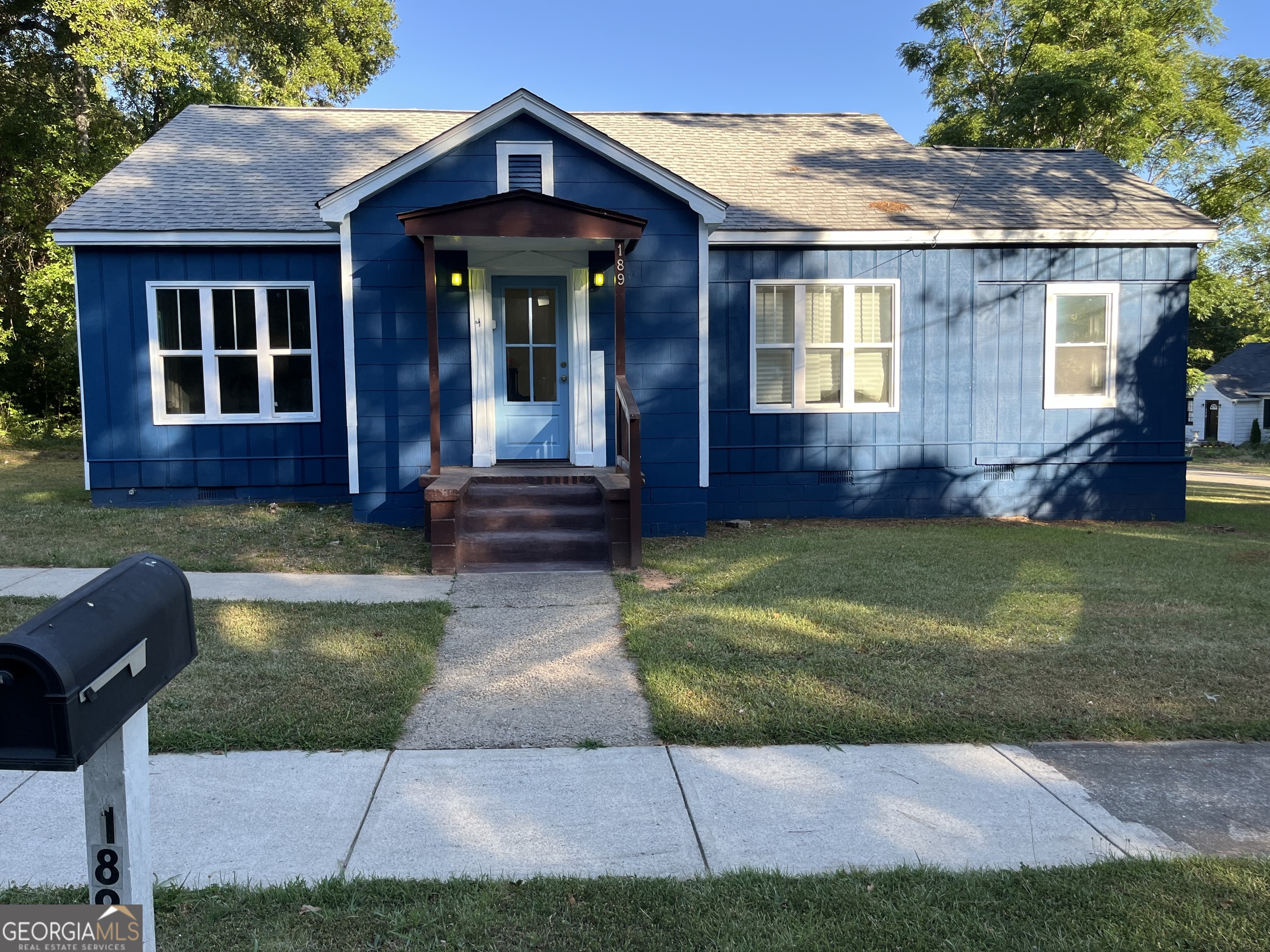 Charming cottage in town loaded with lots of character. 2BR/1BA w/bonus room. Family and Dining room are very spacious with hardwood floors throughout. Freshly painted inside/outside.New tile floors in bathroom. Large laundry room/mud room area off kitchen.This home has Newer roof installed in 2019.New HVAC will be installed before closing. Beautiful corner lot with large outbuilding. Close to everything walk or drive!! Must see!!