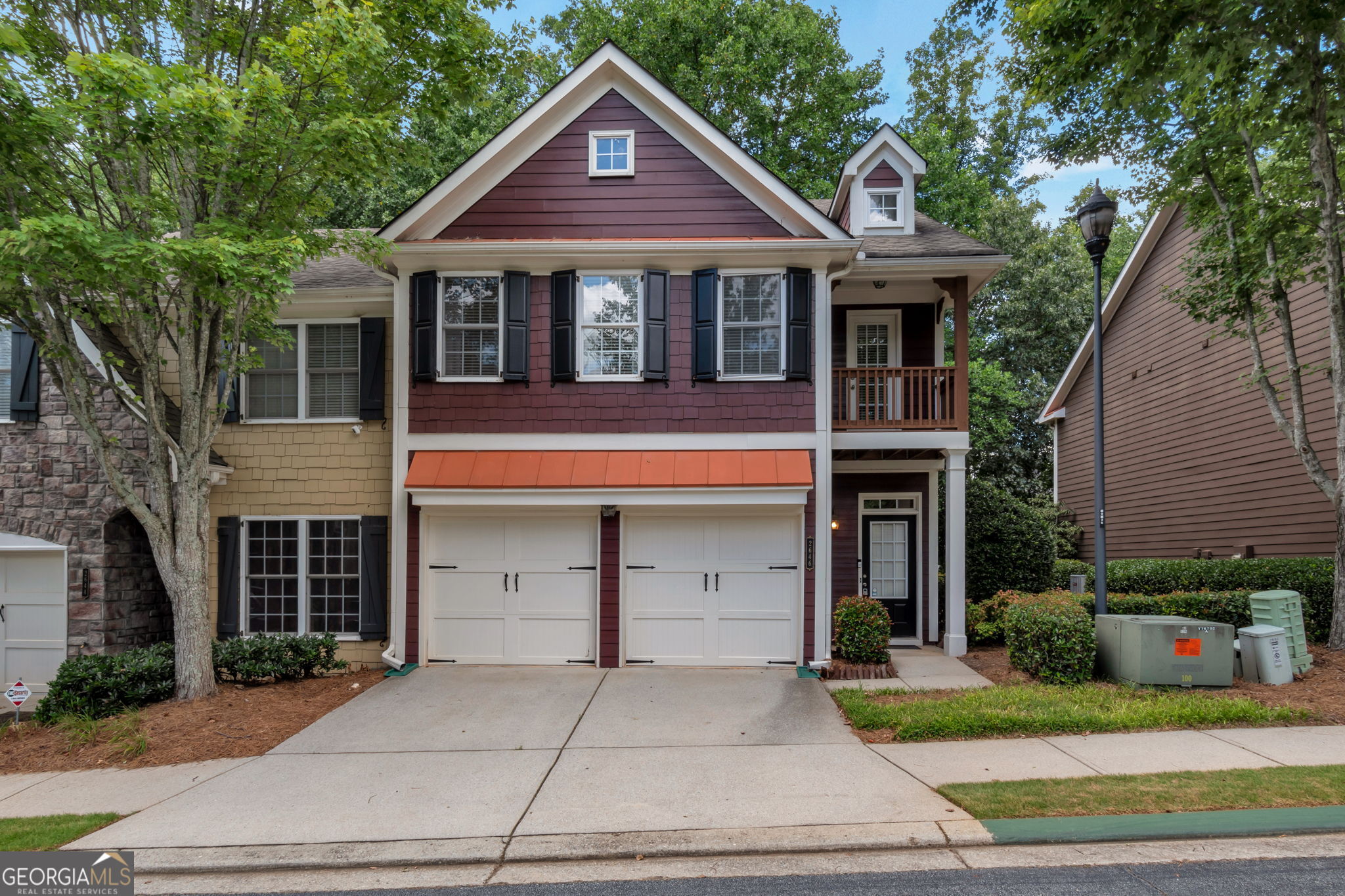Move in ready! charming 3 bedroom, 2.5 bath townhouse in a gated community. End unit. Hardwood flooring throughout the main level. Kitchen with an island is open to the spacious living room. Upstairs, a master suite with a private bathroom and walk-in closet, and two additional spacious bedrooms. Private backyard. Close to I-85, Gas South Arena, shopping, entertainment, and schools. The association fee includes the water cost.