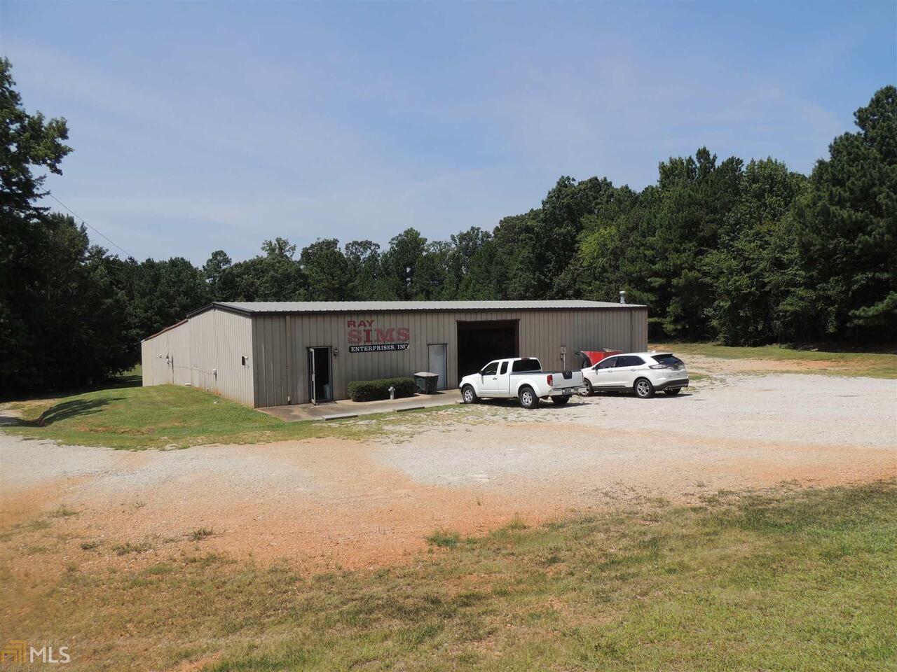 Be your own boss! 75 x 35 building with two additional rooms, 75 x 18, 50 x 20 and parking shelter situated on 3.26 AC. There are also (2) half baths and shower, and office area. Building was formerly used for trucking company. Conveniently located just outside city limits.