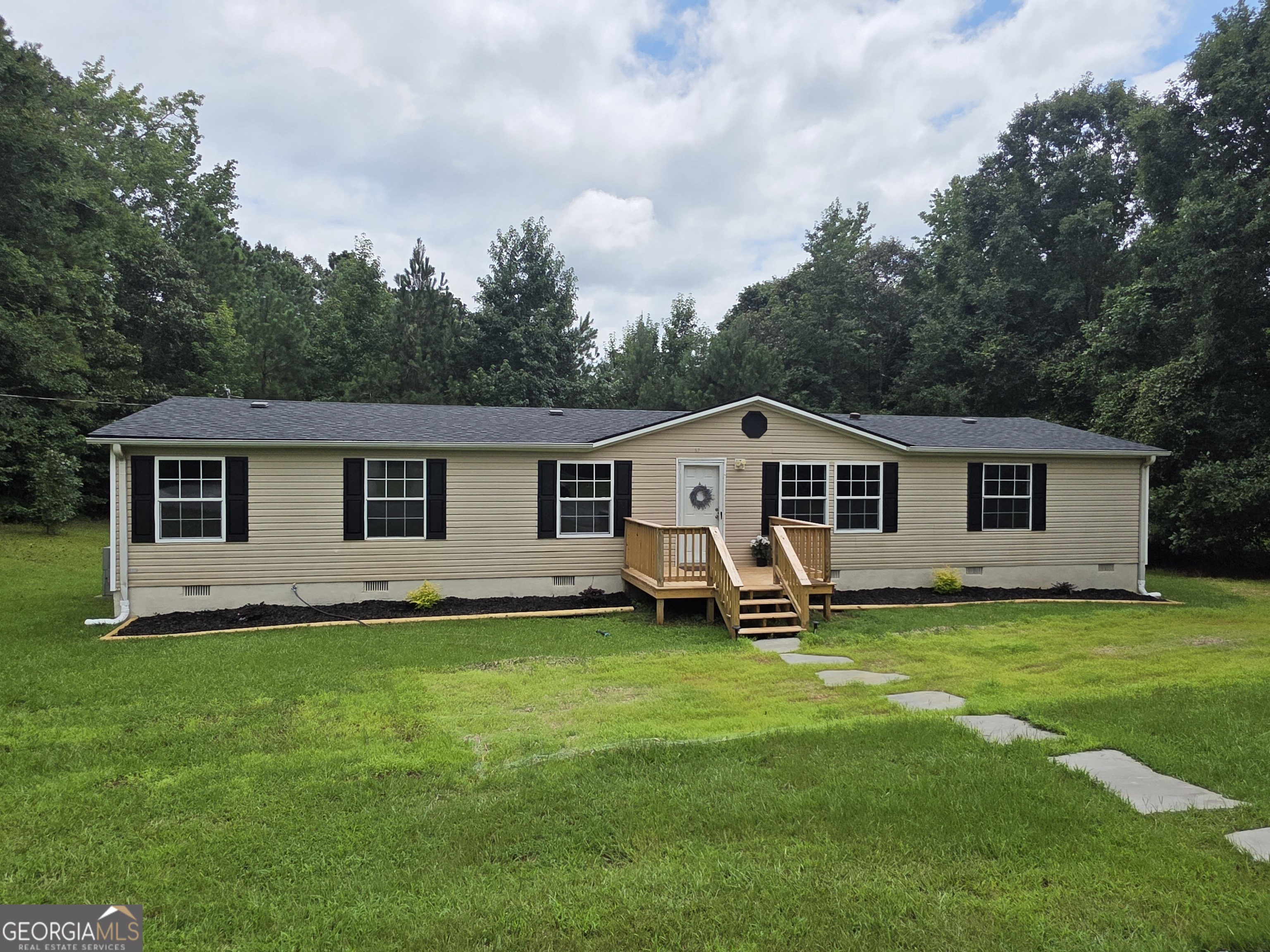 MOVE IN READY on this Completely Remodeled Home on 6+ acres! * Welcome Home to this 3 bedroom, 2 bath home in Beautiful Forsyth! You will love this Open Floor plan with almost 2000 sq ft, where you have a very large Open living area w/fireplace that opens up to the beautiful Gourmet kitchen with updated cabinets, new granite countertops, brand-new stainless-steel appliances, that moves into a large dining room. The primary bedroom is very spacious and has a walk-in closet. In the en-suite bathroom you will find another large walk-in closet, brand new double vanity, an amazing standalone soaking tub, new shower and toilet. The home also features a split bedroom plan, so on the other side of the home you will find 2 large secondary bedrooms with walk in closets and an updated hall bath. All new flooring, paint, water heater, light fixtures, plumbing fixtures, deck, front porch, some new windows, interior doors, counter tops, cabinets and more! The brand-new back deck is large enough for all of your outdoor furniture and grill to enjoy the wonderful, peaceful evenings in the country! Sitting on over 6 acres of land, you have all the privacy you could ask for! Perfect for the people wanting their own land to enjoy or hunt. Roof is only 3 years old, too! Being only about 5-7 mins from I-75, 10 mins from downtown Forsyth with the great dining and shopping on the square, great Monroe County schools, and all the benefits of private, country living, and ALL of the Wonderful Upgrades, you couldn't ask for a better home! Perfectly Move In Ready!