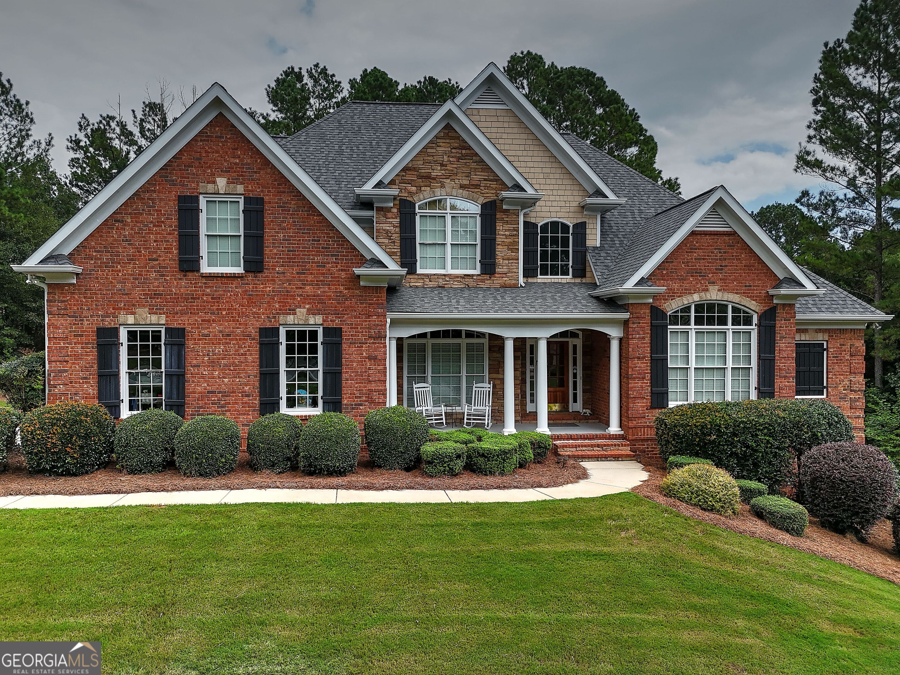 This home is made for both everyday living and unforgettable entertaining! Step inside and you'll find soaring ceilings, a two-story great room with a 42" fireplace, and gorgeous custom trim throughout. The chef's kitchen is a dream with an oversized island, gas cooktop, walk-in pantry, stainless appliances, and a keeping room with a cozy stone fireplace. The owner's suite includes a spa-like bath and custom closet system, while upstairs boasts 3 oversized bedrooms (1 ensuite), a loft, and jack-n-jill bath. The terrace level expands your lifestyle with a family room, office, workout space, bedroom, bath, and workshop-plenty of room for everyone. Outdoors is where this home shines: newly tiled screened-in porch and an oversized Ipe Brazilian wood deck, a $52K upgrade, built to withstand decades of use while staying beautiful and resistant to the elements. All of this is nestled in Boulder Springs, where you'll enjoy 140 acres of green space, a private lake, clubhouse, two pools, tennis courts, and miles of trails-plus the award-winning Oconee County school district.