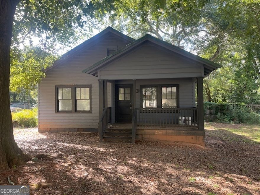 Nice 2 bedroom 1 bath frame home, living room, kitchen/dining combination with appliances and plenty of cabinets, central heat  and air, laundry room, front porch, side porch, deck, situated on  a level corner lot.