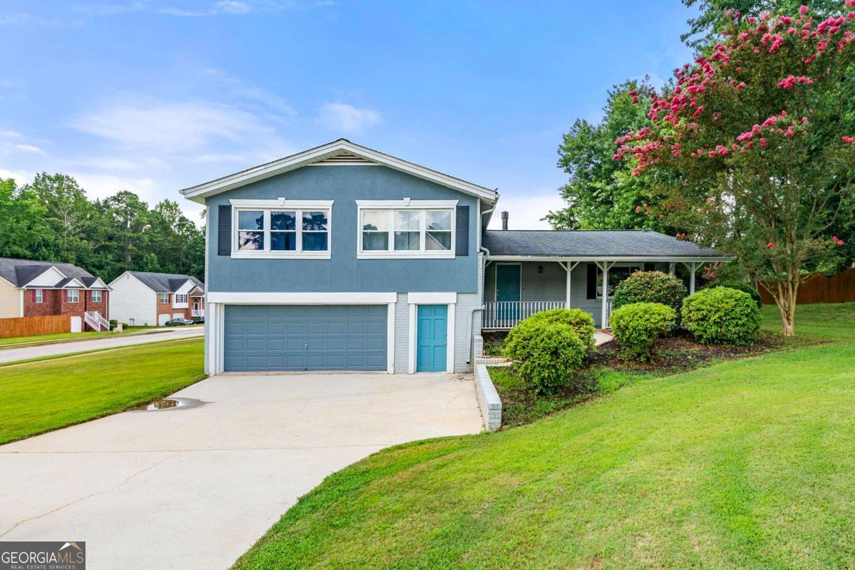 Charming Renovated Split-Level Home on a Corner Lot! This lovely 3-bedroom, 2-bath home offers an open, updated floor plan with high ceilings, stylish flooring, and neutral decor throughout. Situated on a desirable corner lot, this rare four-sided brick home provides exceptional value and curb appeal. The spacious kitchen features a center island with granite countertops-perfect for cooking and entertaining. The oversized deck and large yard offer plenty of outdoor space for gatherings or relaxing. The expansive primary suite includes a sitting area and his-and-hers closets, while the secondary bedrooms are generously sized. The partial basement presents a great opportunity to increase your living space-finish it to suit your needs! Excellent location with convenience and comfort-don't miss this one!