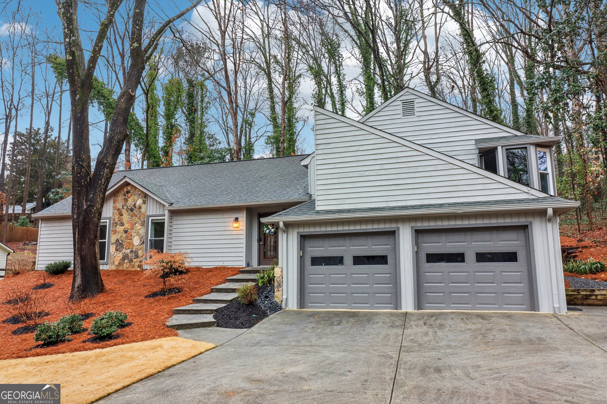 Welcome Home to 2163 Fox Hound Chase in Chimney Springs! This is your chance to own a beautifully updated home in one of East Cobb's most desirable communities! Nestled in the heart of Chimney Springs, this home offers the perfect trifecta-top-rated schools, an active and friendly neighborhood, and a prime East Cobb location. Step inside to discover a thoughtfully renovated 3-bedroom, 2.5-bath home, where every detail has been carefully considered. Gorgeous new hardwood flooring, new windows, updated lighting, and renovated bathrooms elevate the interiors, while an updated kitchen with stainless steel appliances, granite countertops, and abundant storage makes cooking a delight. The spacious primary suite is a true retreat, very spacious with a sitting area, multiple closets. The spa-like bath featuring double vanities, a separate shower, and a spa tub overlooking the serene backyard. Natural light floods the home, enhancing the inviting floor plan. Downstairs, an unfinished terrace-level room offers incredible flexibility-perfect for a rec room, home office, in-law suite, or workshop. Outside, a huge screened-in porch provides the perfect setting for morning coffee or evening gatherings, all while overlooking a lush, private wooded backyard. Beyond your doorstep, Chimney Springs offers a vibrant lifestyle, complete with a swim and tennis community, a clubhouse, parks, scenic walking trails, and a picturesque lake. Social events bring neighbors together, making this one of the friendliest communities in East Cobb!
