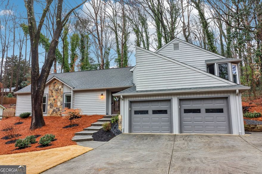 Welcome Home to 2163 Fox Hound Chase in Chimney Springs! This is your chance to own a beautifully updated home in one of East Cobb's most desirable communities! Nestled in the heart of Chimney Springs, this home offers the perfect trifecta-top-rated schools, an active and friendly neighborhood, and a prime East Cobb location. Step inside to discover a thoughtfully renovated 3-bedroom, 2.5-bath home, where every detail has been carefully considered. Gorgeous new hardwood flooring, new windows, updated lighting, and renovated bathrooms elevate the interiors, while an updated kitchen with stainless steel appliances, granite countertops, and abundant storage makes cooking a delight. The spacious primary suite is a true retreat, very spacious with a sitting area, multiple closets. The spa-like bath featuring double vanities, a separate shower, and a spa tub overlooking the serene backyard. Natural light floods the home, enhancing the inviting floor plan. Downstairs, an unfinished terrace-level room offers incredible flexibility-perfect for a rec room, home office, in-law suite, or workshop. Outside, a huge screened-in porch provides the perfect setting for morning coffee or evening gatherings, all while overlooking a lush, private wooded backyard. Beyond your doorstep, Chimney Springs offers a vibrant lifestyle, complete with a swim and tennis community, a clubhouse, parks, scenic walking trails, and a picturesque lake. Social events bring neighbors together, making this one of the friendliest communities in East Cobb!