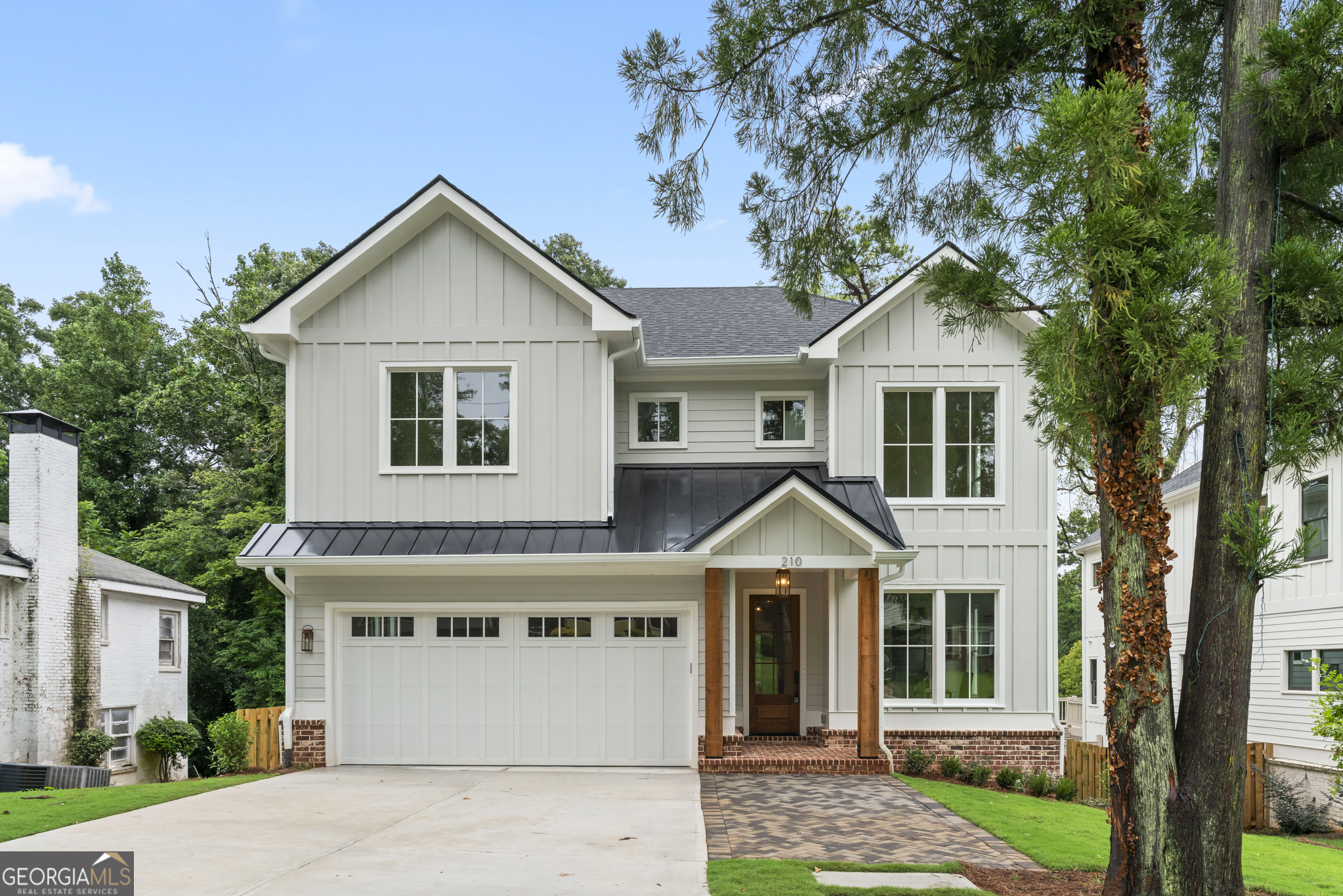 Fantastic new construction in City of Decatur! This beautiful home checks all the boxes and sits on an oversized, privacy-fenced lot offering endless possibilities. With 6br/6.5ba and a finished basement, this designer-inspired home offers excellent space, a thoughtful floor plan, and spectacular finishes. The statement-making foyer with custom moldings and designer light fixtures leads to a very open and functional main-level floor plan. The kitchen features an expansive island with quartz waterfall countertops, upgraded appliance package, a walk-in pantry and custom cabinetry to the ceiling with undercabinet and even baseboard lighting - no way! The family room, featuring a custom fireplace and built-in cabinetry and the light-filled dining room both overlook an oversized screened porch with vaulted ceiling and outdoor fireplace. The main level also features a convenient attached two-car garage, a half bath, large mudroom, and a bedroom with ensuite bath. The designer lighting and plumbing fixtures and gorgeous white oak hardwood floors continue throughout. Upstairs is highlighted by a stunning owner's suite with vaulted ceiling and wood beams, a beverage center, and an expansive closet with natural light. The primary bathroom features a double vanity, recessed medicine cabinets with integrated lighting, oversized shower with dual showerheads, a soaking tub, and built-in linen cabinet. Upstairs also includes three large secondary bedrooms all with their own bathrooms. Need more living space? Stroll down the sun-drenched staircase to the finished basement with soaring ceilings, white oak floors, and tons of natural light. The basement includes a living room, kitchenette, sixth bedroom, sixth full bath, bonus/exercise room, and covered rear patio. Don't miss the large storage/mechanical room down here. Thoughtful upgrades abound in this home, including a 240 V electric car outlet, tankless water heater and spray-foam insulation. Located in the highly rated Decatur City school system, just blocks from the restaurants, pubs, coffee shops, concerts and festivals of popular Oakhurst Village and just minutes from historic Downtown Decatur, this home truly delivers a Decatur Classic! Fantastico!
