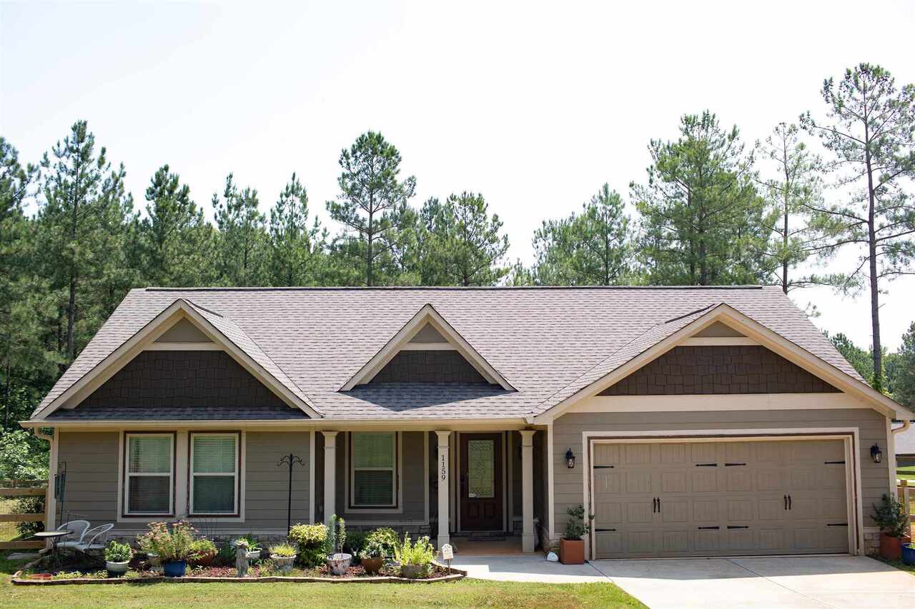 This charming home sits on a gorgeous, peaceful and PRIVATE almost two acre lot on a QUIET street. The large backyard is just perfect for a family as there is a brand new fence in place. Built in 2015, this three bedroom and two bath home has so much life to live! Just think - you do not need to update any major systems as the home is ONLY six years old! No headaches or what ifs here. This adorable ranch includes a spacious master suite with walk in shower and large closet space. The open concept floor plan with two additional bedrooms is spacious and flows nicely. Large two car garage. Large laundry room. PLUS front and back porches to relax on when you come home. Don't miss out on this one!! This is country living at its best!!