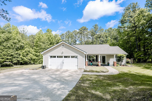 Welcome home to this move-in ready 3bd/2ba ranch set on 1.6 acres with new roof, HVAC, hot water heater, garage door and brand new stainless kitchen appliances. Includes a versatile bonus/flex room with window and full-size door that easily functions as a 4th bedroom, office, dining room or playroom. Open concept living with vaulted ceilings and fireplace that flows into a bright kitchen with pantry & breakfast area. Owners suite offers a soaking tub, seperate shower, and walk-in closet. This smart home features repainted interior in 2024, Starlink, washer/dryer and could be purchased furnished. The property has an expansive sod yard surrounded by wooded privacy, plus a grilling patio, firepit lounge, chicken coop and outbuilding with front porch. The home also has a 2 car garage and RV/boat parking. Schedule your appointment today and come see this beauty for yourself.