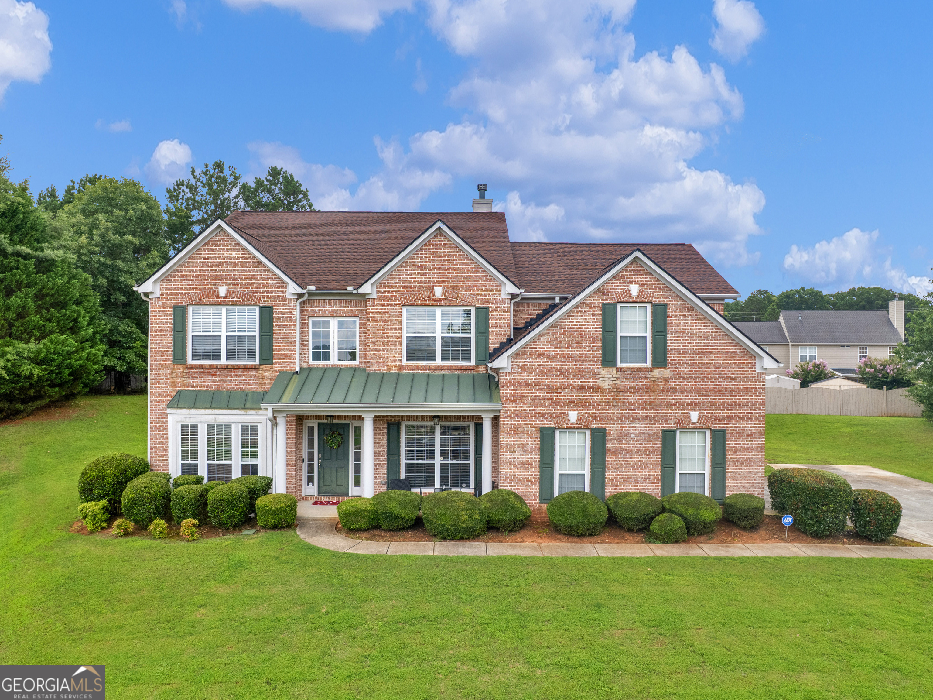 This stunning 5 bedroom, 4 bathroom home offers a perfect blend of comfort and elegance. The spacious primary suite is conveniently located on the main level, providing a private retreat with ease and comfort. Soaring vaulted ceilings and large windows fill the home with natural light, creating a bright and open atmosphere throughout. Enjoy hosting in the formal dining room, and take advantage of the dedicated office-ideal for working from home or managing daily tasks. The kitchen features double ovens, solid surface countertops, cooktop, refrigerator, dishwasher and more. 4 additional large bedrooms upstairs provide extra space for family or visitors. This home is conveniently located to shopping, restaurants and so much more. Ask how you can receive up to $1500 credit by using one of our preferred lenders. Exclusions may apply.