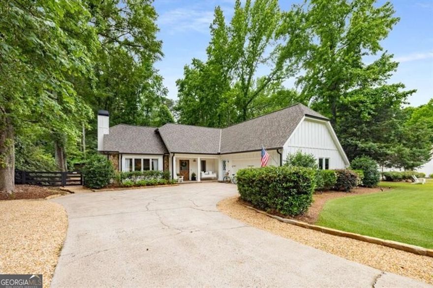 Discover the perfect blend of modern comfort and unbeatable location in this beautifully remodeled home in the heart of downtown Alpharetta. Situated on a spacious, lushly landscaped lot this move-in-ready home offers an inviting open floor plan with three generous bedrooms plus a dedicated office with stylish pocket doors-ideal and beautiful built in shelving perfect for working from home, a play room or another bedroom. The third bedroom upstairs has its own private entrance above the garage but connects to the home as well. Relax in the expansive family room with vaulted ceilings and a cozy stone fireplace, or enjoy outdoor living on the screened porch accessible from the hard to find main level primary bedroom. The stunning primary bathroom has been fully renovated to create a luxurious retreat, complemented by a contemporary, open-concept kitchen and large breakfast room that seamlessly flows out to a private backyard oasis. Open the French doors from the breakfast area to the back deck for this open space ideal for entertaining and let your guests enjoy the beautiful back patio and private backyard tree lined and ready for outdoor games. Recent upgrades include new systems such as roof, HVAC, siding, doors, and professionally landscaped grounds, ensuring peace of mind and low maintenance. Walk to everything downtown Alpharetta has to offer - farmers markets on Saturday, live music, exceptional dining, shopping, and more - making this home not just a fantastic residence, but a wonderful lifestyle. This is your opportunity to own this exceptional property in downtown Alpharetta!
