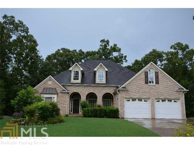 Gorgeous ranch with arched entrance outside leading into a foyer with soaring ceilings and hardwood floors. Formal dining room with beautiful windows, with a view into the living room with gas fireplace. Kitchen has all stainless appliances and granite countertops with a breakfast area surrounded with windows overlooking private backyard. Also has a completely finished terrace level with bonus rooms, full bath, and kitchenette. Home is extremely large and has many bonus rooms!