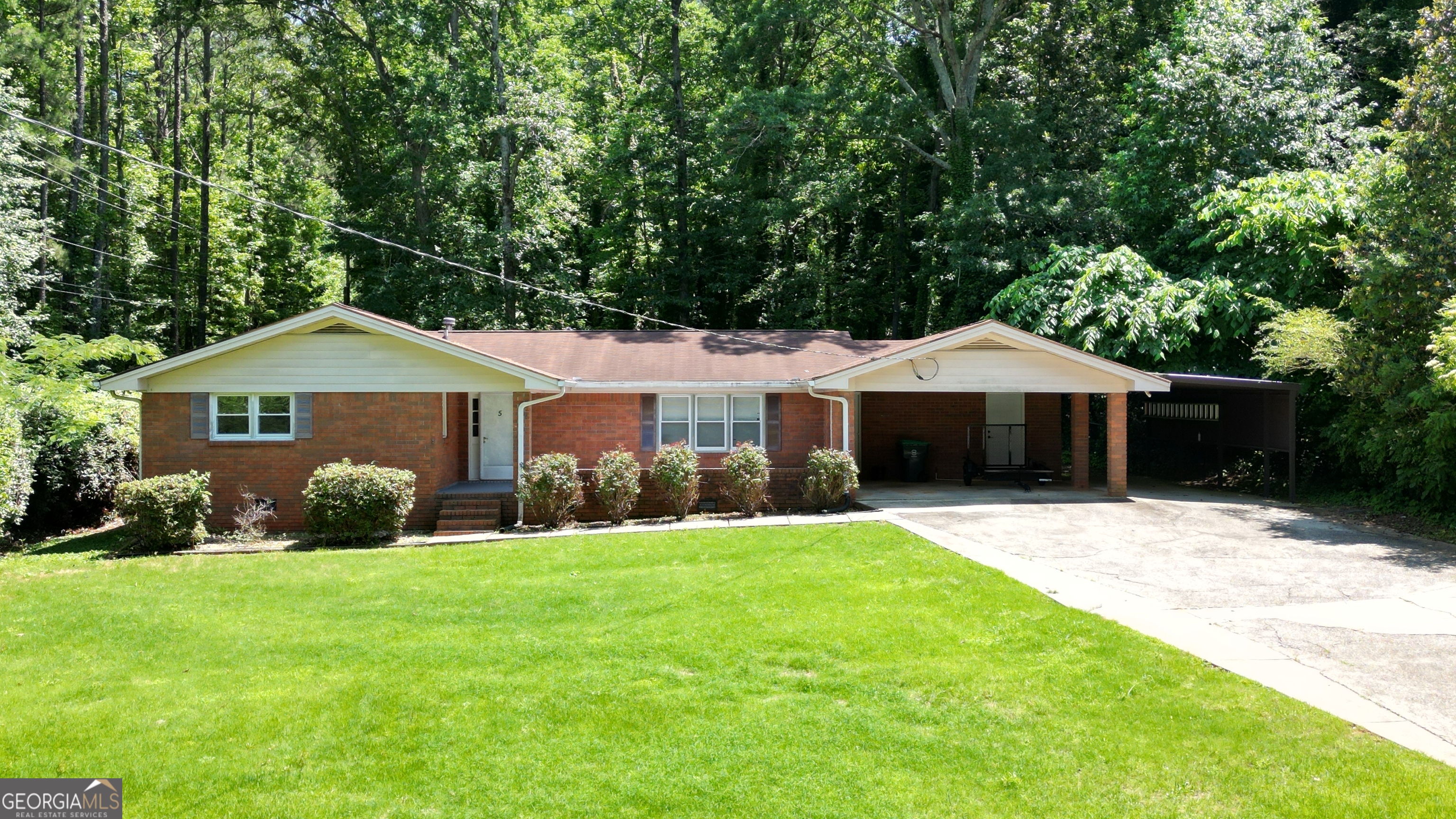 4-sided brick ranch, 3 bedroom 2 bathrooms home. This home is in the Lake Talmadge community. Access to fishing, boating, and other activities with a lake located in the center of the neighborhood. Large backyard, patio and sunroom for the whole family to enjoy. This house is conveniently located. Shopping is around the corner, close to the interstate and minutes to the airport. This home sits on a large lot! The interior, has a spacious living-dining room, sun room/porch over looking the back yard. This home is perfect for anyone looking for a house they can move into that has character and can make their own. Quiet conveniently located community!