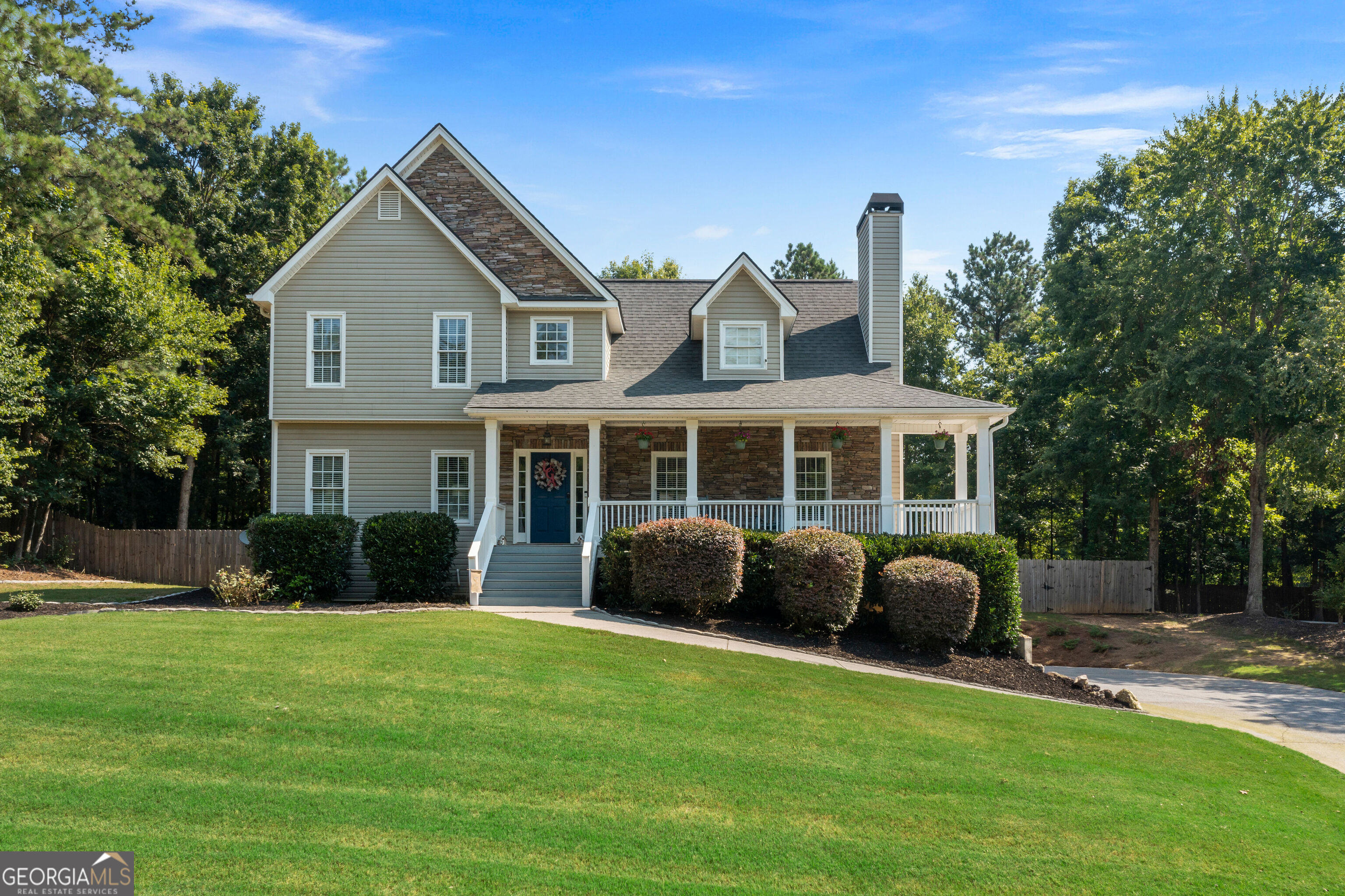 Gorgeous home located on large cul-de-sac lot! This home welcomes you with a charming covered front porch, stone front accents, and an easy to maintain front landscaping. Enter into the home through the two story foyer where you are greeted by hardwood flooring and great natural light. The family room offers a cozy space with a slate accented fireplace complete with mantle and ample space for you to unwind. Head into the updated kitchen where you will enjoy white cabinets, subway tile backsplash, beautiful stone countertops, and stainless steel appliances including a range hood. You will have two places to dine and entertain with a breakfast nook just off the kitchen as well as a separate dining room adjacent to the kitchen. Your master is located on the main and features a large bedroom, huge walk in closet, and en suite bath complete with an oversized shower, soaking tub, and double vanities. Head upstairs where you will find three additional bedrooms that are all quite spacious and offer nice closets. Also on the upper is a shared full bath, laundry in hall for your convenience, and a finished loft space perfect for a bonus area or office. Enjoy a side entry garage with additional parking in driveway and access to the unfinished basement where you have a nice storage area. Enjoy the outdoors with an enormous, tree lined backyard complete with privacy fence and fire pit. Roof and 1 HVAC are less than 1 year old and 2nd HVAC is 2 months old!