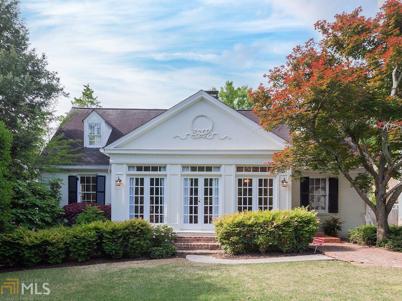Stunning Garden Hills Masterpiece!  Traditional style home with enormous square footage, classic foyer entry, decorative fireplace, built-in shelving, hardwood flooring, oversized windows, plantation shutters & skylights throughout. Gorgeous eat-in kitchen, white cabinetry, tile backsplash, double ovens and a cozy breakfast banquette!  The sunny family room lined with windows overlooks the large backyard with 2 flat spaces perfect for play or pets!Upstairs master suite, walk-in closet with built-in shelving.  Plenty of bonus space & bedrooms for work from home, basement man cave w/ extra laundry hook-ups, endless work/live/play living options!  Spacious garage with plenty of room for storage. Covered back patio. This unbeatable location is only steps away from AIS/Garden Hills Elementary, the park, pool & playground!  Hurry, you donGÇÖt want to miss this one!