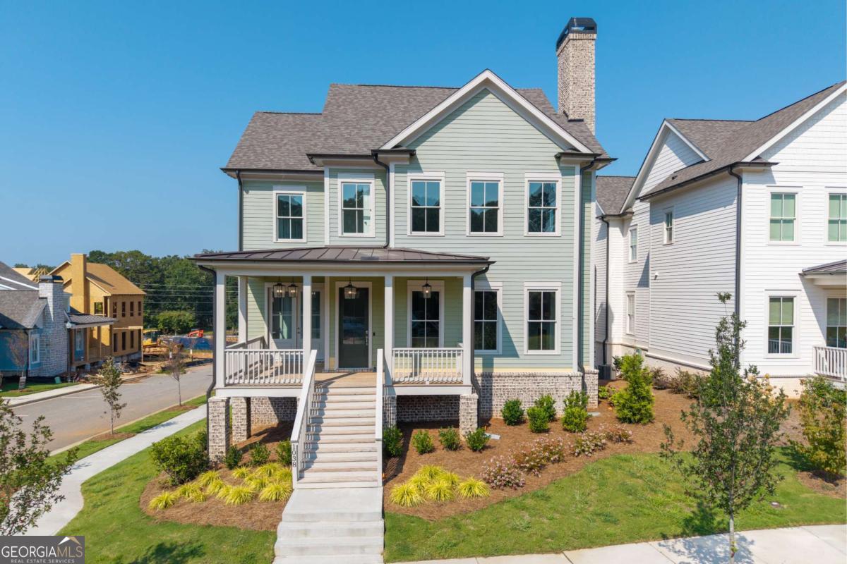 Our preferred lender has 5% rates!! Call for more information! Perfectly designed for today's on-the-go homeowner, this stunning residence in the Village section of Crossroads offers the ultimate lock-and-leave lifestyle. With HOA-maintained grounds and sewer service included in the monthly fees, you'll spend less time on upkeep and more time enjoying everything this sought-after Milton community has to offer. The heart of the home is the chef's kitchen-an entertainer's dream-showcasing custom ceiling-height cabinetry, quartz countertops, a porcelain farmhouse sink, and a professional-grade 48" Thermador gas range with six burners, griddle, and double ovens. A walk-in pantry provides both function and organization, keeping essentials neatly tucked away. The main level is filled with natural light and features an open-concept design with a dedicated dining space and a seamless flow for everyday living and entertaining. Upstairs, a spacious flex area offers room for a media space, playroom, or home office, while three additional bedrooms provide comfort and privacy. The unfinished terrace level is a blank canvas, ready for your personal touch-whether that's a gym, home theater, or guest retreat. Blending refined style with low-maintenance ease, this home is just moments from dining, shopping, and services, and is served by top-rated Milton schools. It's not just a home-it's a lifestyle.