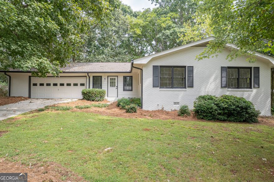 Welcome home to this beautifully updated ranch in the heart of Marietta. This "Like New" home boasts 3 bedrooms/ 3 full baths and a 4th airy bedroom loft that can double as an office or bonus room. All new appliances, new paint, new floors, brand new roof, updated bathrooms and kitchen- this home is turn-key and an entertainers dream! The secluded backyard is ready for you to add your touch to enjoy the outdoors peacefully. Located just minutes from Marietta Square and convenient access to I-75.     Don't miss this chance to call this your new home.