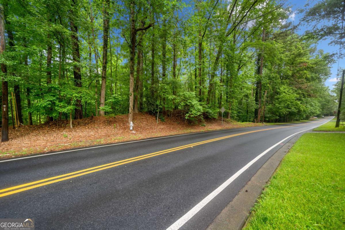 INCREDIBLE OPPORTUNITY TO BUY AND BUILD YOUR DREAM HOME ON SOUGHT AFTER SPALDING DRIVE. Lovely 1.45 acre lot with mature hardwoods and creek very close proximity to the Chattahoochee River.