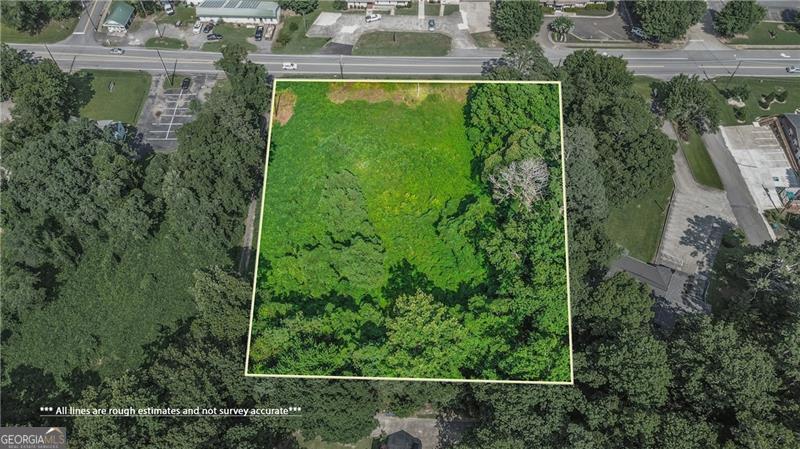 Highly visible commercial property on 1.63 acre lot! Excellent visibility on Marietta Hwy with high traffic counts. The property is zoned General Commercial. The property offers 234 FT of road frontage on Marietta Hwy. Perfect location for Offices on the front and a full basement that can be accessed in the back. This property is located less than 1.5 miles to Interstate 575 at exit 14. Northside Cherokee, Canton Marketplace and Interstate 575 (at exits 14 and 16) are less than 5 minutes away.