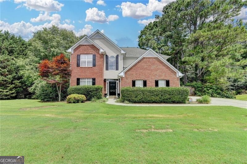 Charming 4-Bedroom Home on 1 Acre in Dacula! Welcome to this lovely two-story home nestled on a spacious 1-acre lot in the heart of Dacula. Featuring 4 bedrooms and 2.5 baths, this residence offers comfort, style, and room to grow. Step inside to discover luxurious laminate flooring throughout the main level, featuring a warm and inviting family room with a fireplace, a separate living room, and a formal dining room-ideal for entertaining. The kitchen boasts classic white cabinetry and opens seamlessly to the family room, creating a bright and connected living space. Upstairs, you'll find generously sized secondary bedrooms and a large owner's suite complete with an upgraded shower for a spa-like experience. Enjoy the privacy of a side-entry garage and unwind in the peaceful, partially wooded backyard-an ideal setting for gatherings, gardening, or future outdoor enhancements. This home offers endless possibilities both inside and out. Schedule your showing today and see all that this Dacula gem has to offer!