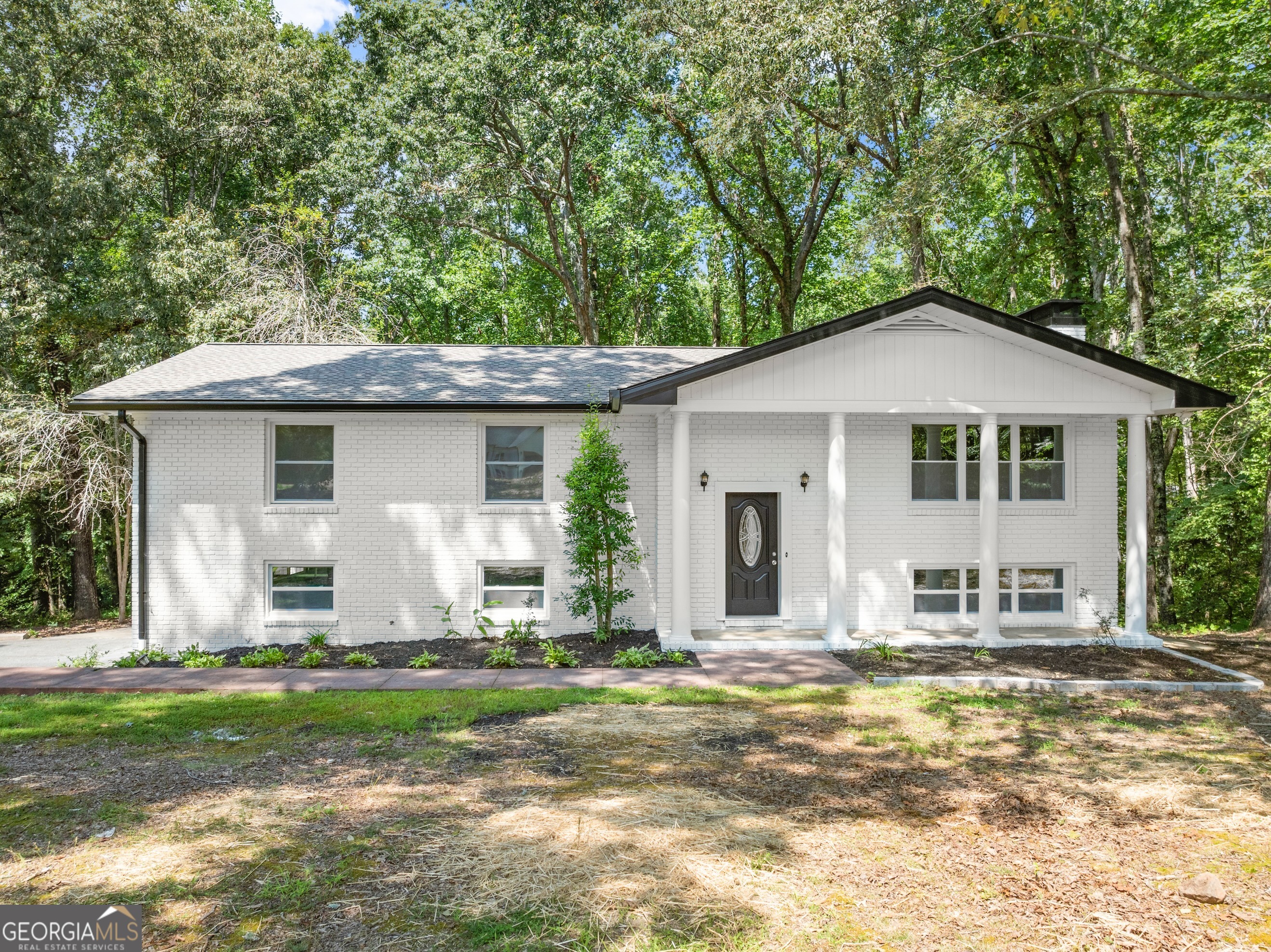 NO HOA!!! Bring your boats and campers!!! This incredible four-bedroom, three-bath home has been updated with everything new. All new flooring, windows, appliances, new back deck, all new tile bathrooms/showers, countertops, sinks, toilets. The Kitchen has painted cabinets, countertops, fixtures, and appliances. All cabinets are wood and have been painted, along with built-ins in the family room and the downstairs den. All garage doors are new. Both garage and detached garage floors have been painted. The Exterior brick has been painted farmhouse white: all new gutters, a new roof, and siding on the detached garage. The roof, HVAC, and water heater are less than two years old. You must come to see to believe all the great things about this great home, near Dawson County Schools and close to town and the outlet mall.