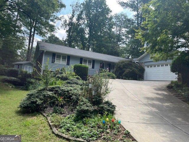 Charming Ranch in Dunwoody North with Full Basement. Welcome to this spacious and well-maintained ranch home located in the desirable Dunwoody North neighborhood. This home offers a generous layout featuring a large family room with a vaulted ceiling and cozy fireplace, perfect for relaxing or entertaining. Enjoy separate formal dining and living rooms, both with beautiful hardwood floors throughout. The bright breakfast room opens to a private side patio and a quaint potting shed-ideal for gardening enthusiasts. The full, unfinished basement provides endless possibilities and includes a cedar closet for added storage. The large, flat backyard offers plenty of space for outdoor activities and landscaping. New Roof and HVAC system Full two-car garage with direct access to the mudroom and kitchen Convenient one-level living with potential for customization Don't miss this opportunity to own a solid home in a prime location with excellent potential