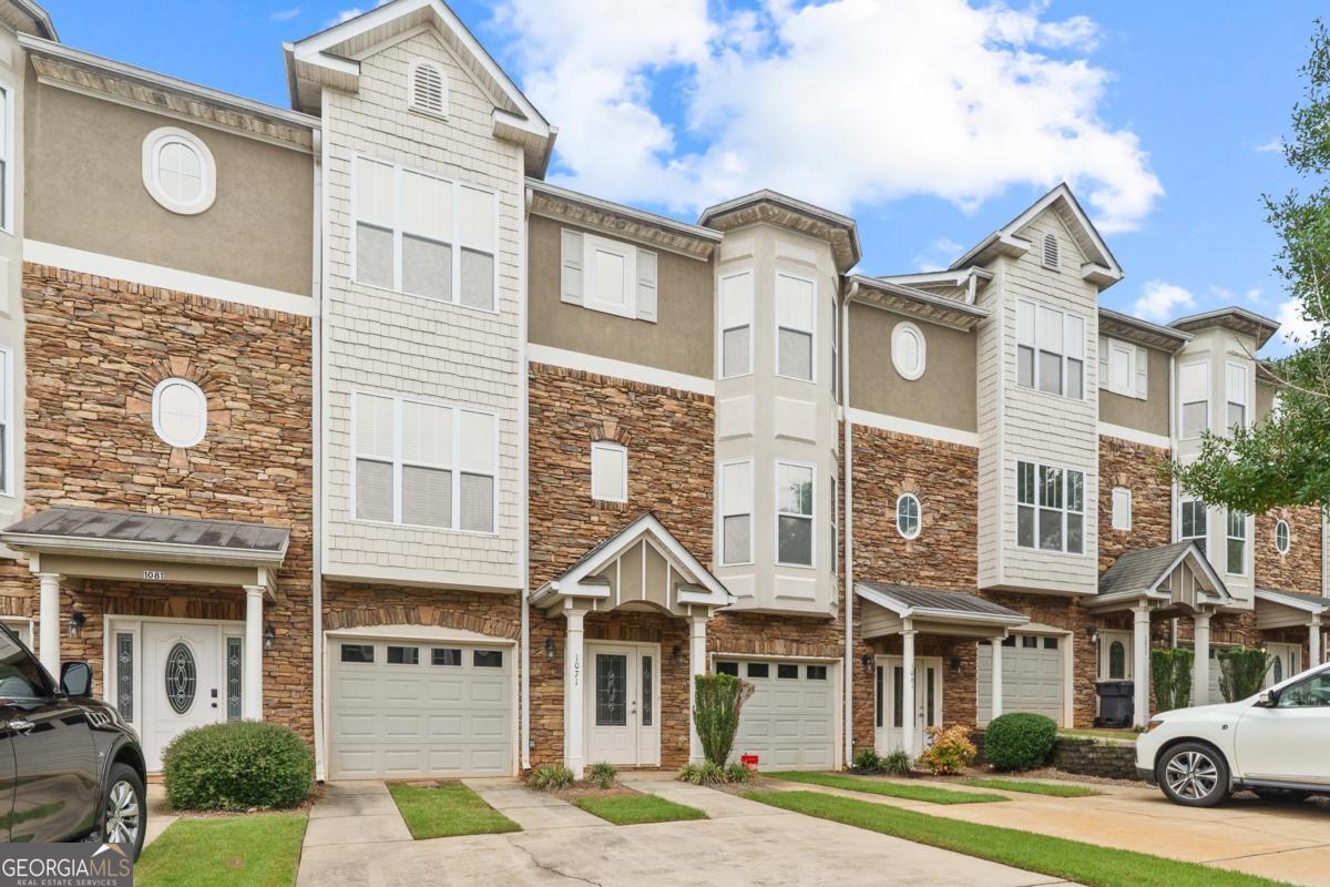 Welcome to 1071 Azalea Street, ideally located in the heart of Lake Oconee. This 3-bedroom, 3.5-bath townhome in The Reserve at Park Place offers the perfect blend of comfort, convenience, and low-maintenance living. Move-in ready and thoughtfully designed, the home features generously sized rooms and a well-appointed kitchen with stainless steel appliances. The functional layout includes a bedroom and full bath on the first floor; an open-concept main living area with kitchen, dining space, and half bath on the second floor-complete with access to a brand-new deck, ideal for relaxing or entertaining; and two additional bedrooms on the third floor, each with its own private bath. Situated just minutes from shopping, dining, top-rated schools, and all the recreational opportunities Lake Oconee has to offer, this home also includes access to community amenities such as a pool and tennis courts. Whether you're seeking a full-time residence or a weekend getaway, 1071 Azalea Street is ready to welcome you home. Schedule your private showing today.