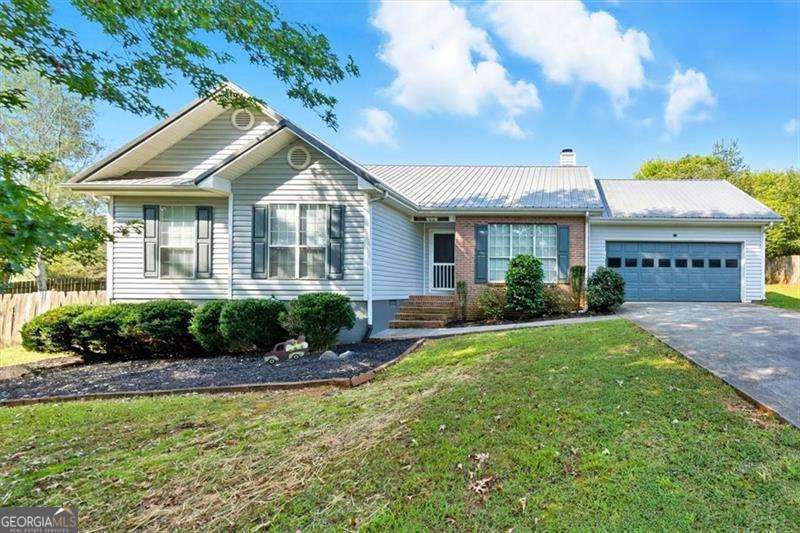 Pristine Ranch home now available in awesome location as minutes to 75, 41 and Buc-ees! You will fall in love when you walk through the door. 3 bed, 2 bath home is just what your buyer is looking for as nestled on this large 0.65, well landscaped lot. Privacy fence is great for privacy, family, and pets! Lovely open floorplan with beautiful, soft decor. Fabulous LVP floors throughout this home for easy cleaning. Pass-thru window from kitchen allows viewing living room and dining room. Fireplace is located in the living room, awesome kitchen includes Refrigerator, stove, dishwasher and vent hood. Lovely cabinets and place for eat-in area. Easy access to 2-car garage on kitchen level. Dining room offers access to covered porch that overlooks this fabulous fenced backyard. The primary bedroom is spacious with walk-in closet and large bath with Separate tub and shower. Both secondary bedrooms are a good size and large closets. The kids will love the playset staying with this home at closing.
