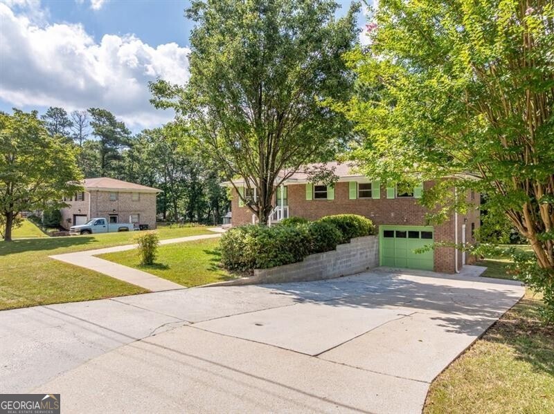 Charming One-Level Brick Ranch on Spacious Lot! Welcome home to this beautifully updated all-brick ranch offering the ease of one-level living with a full unfinished basement for endless possibilities. Situated on a large, level lot, this home features a freshly updated kitchen, complete with modern appliances and new countertops, perfect for everyday living or entertaining guests. Step inside to find brand-new LVP flooring throughout and a freshly painted interior, creating a bright and welcoming atmosphere. Enjoy plenty of parking, including convenient basement garage access for extra storage or a workshop space. Move in with confidence and peace of mind. Whether you're looking to downsize or purchase your first home, this well-maintained property offers comfort, value, and room to grow. Huge driveway with space for RV or Boat.