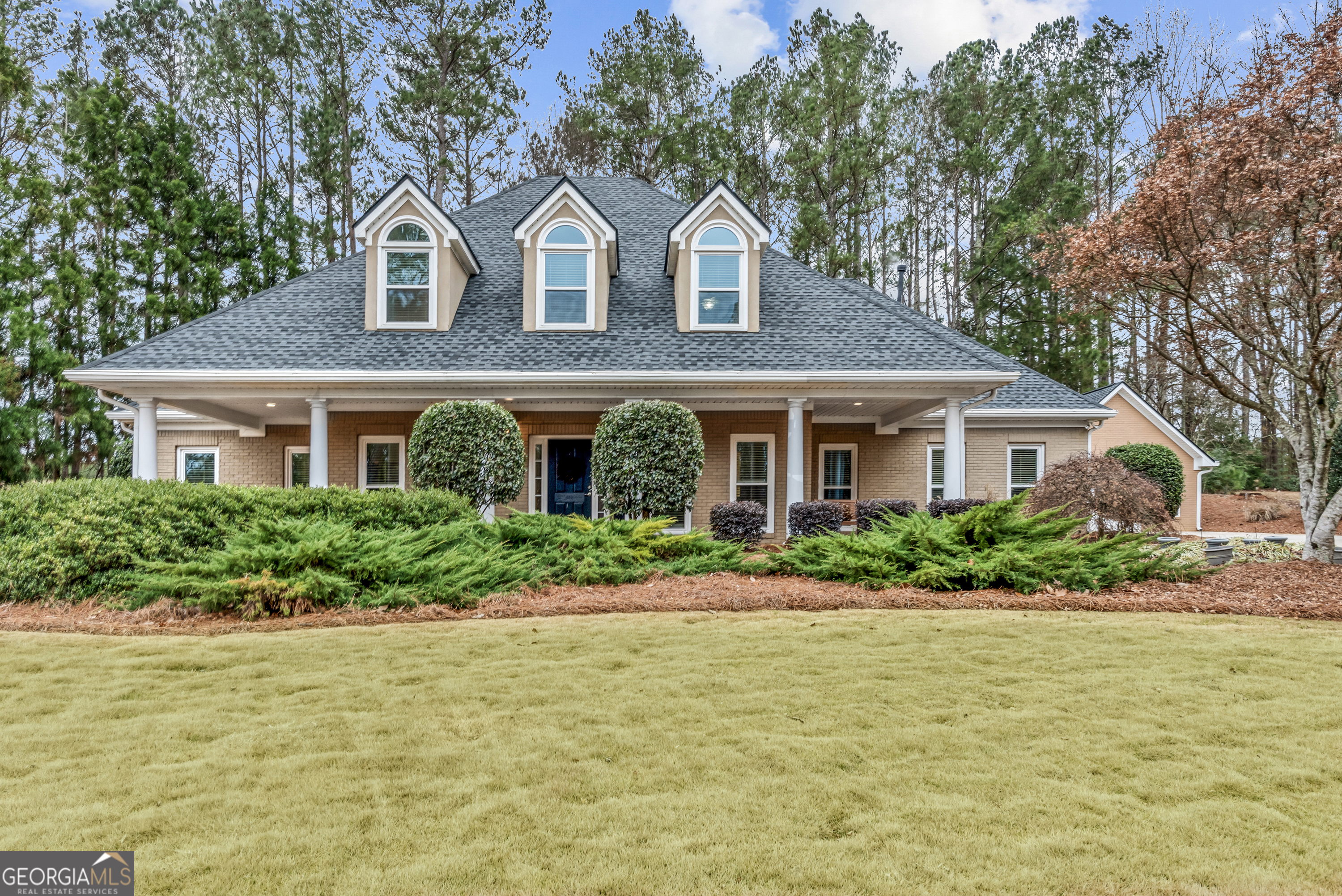 Welcome to 2407 Honey Ct, an updated 4-bedroom, 3.5-bathroom home with detached workshop, located in the prestigious Lake Dow North community in McDonough, Georgia. This home offers a perfect blend of luxury, comfort, and modern amenities, making it an ideal haven for discerning homeowners. As you walk in, you'll see the formal dining room and study. The heart of the home-the kitchen-has been meticulously renovated to include top-of-the-line appliances and sleek countertops, making it a chef's dream. The main-level primary suite ensures privacy and convenience, featuring hardwood floors and an updated en-suite bathroom, complete with oversized closet space. All bathrooms have been tastefully updated. Upstairs are three additional bedrooms, each are oversized, offering comfort and extra storage, perfect for kids, extended family and guests. There's also a fire pit and wiring for an optional hot tub. Enjoy mornings or evenings on the patio, overlooking the 8th hole of the Georgia National Golf Club. For those with a penchant for DIY projects or professional craftsmanship, this home includes a dedicated workshop outfitted with two 220V electrical outlets-a rare and valuable feature for hobbyists and entrepreneurs alike. Beyond the home, Lake Dow North offers a lifestyle rich in amenities. Residents enjoy private access to Lake Dow, perfect for boating, fishing, and relaxing by the water. The Georgia National Golf Club, located within the community, is a championship-caliber private course offering a challenging yet scenic experience for golf enthusiasts. Additionally, optional membership opportunities at the Lake Dow Club provide access to a pool, fitness center, and tennis courts.