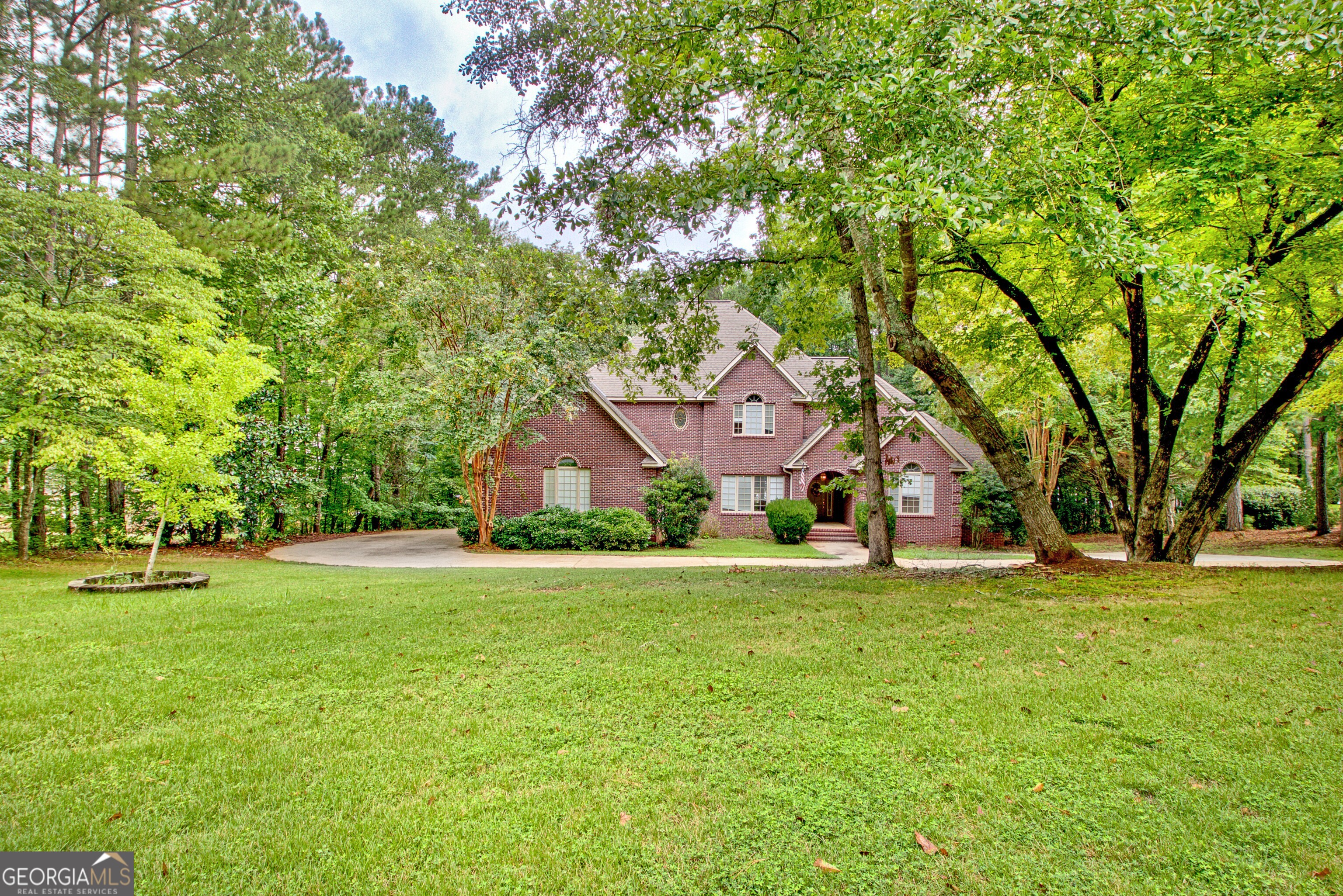 Elegant Lakeside Living in Sought-After Community Beautifully crafted 4-bedroom, 3.5 bath brick home on nearly an acre with stunning views of West Point Lake. The light-filled family room boasts soaring ceilings and a wall of windows framing the water. A gourmet kitchen with granite countertops, stainless steel appliances, and abundant cabinetry flows into the dining area for easy entertaining. The main-level primary suite features a spa-inspired bath and direct access to the expansive deck overlooking the natural backyard and lake. Upstairs offers spacious bedrooms and additional baths, perfect for guests, office space, or hobbies. Enjoy community swim and tennis amenities in one of LaGrange's most desirable neighborhoods. As a special incentive, the seller is offering a $4,000 credit towards buyer closing costs or future updates with an accepted offer.