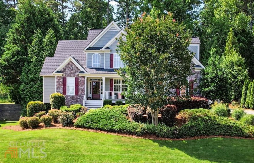 Beautiful move-in ready home just minutes from Lake Lanier. Home has an open floor plan and boasts numerous recent renovations and upgrades. Inviting main living room showcases stone fireplace with reclaimed wood mantle, hardwood floors and vaulted ceilings. Chef's kitchen includes granite countertops, tile backsplash, refinished cabinets, and Samsung stainless steel appliances. Breakfast nook plus separate formal dining room provide plenty of entertaining space. Spacious master bedroom on main features new luxury spa bathroom, including quartz countertops, tile shower with glass surround, and soaking tub. Large guest suite includes separate sitting room plus renovated bathroom. All other guest baths have also been recently updated. Large finished basement includes built in entertainment/media center, wet bar, and new tile floors. Pool table staying with the house is optional. Exclusive backyard features new covered patio plus hot tub. Attached double garage, plus large detached 3rd car garage perfect for storing a boat, trailer, or vehicle, or for using as a workshop. In ground sprinkler system. New roof and exterior paint 2 years ago. Neighborhood has a pool and is very close to Chattahoochee Elementary School.