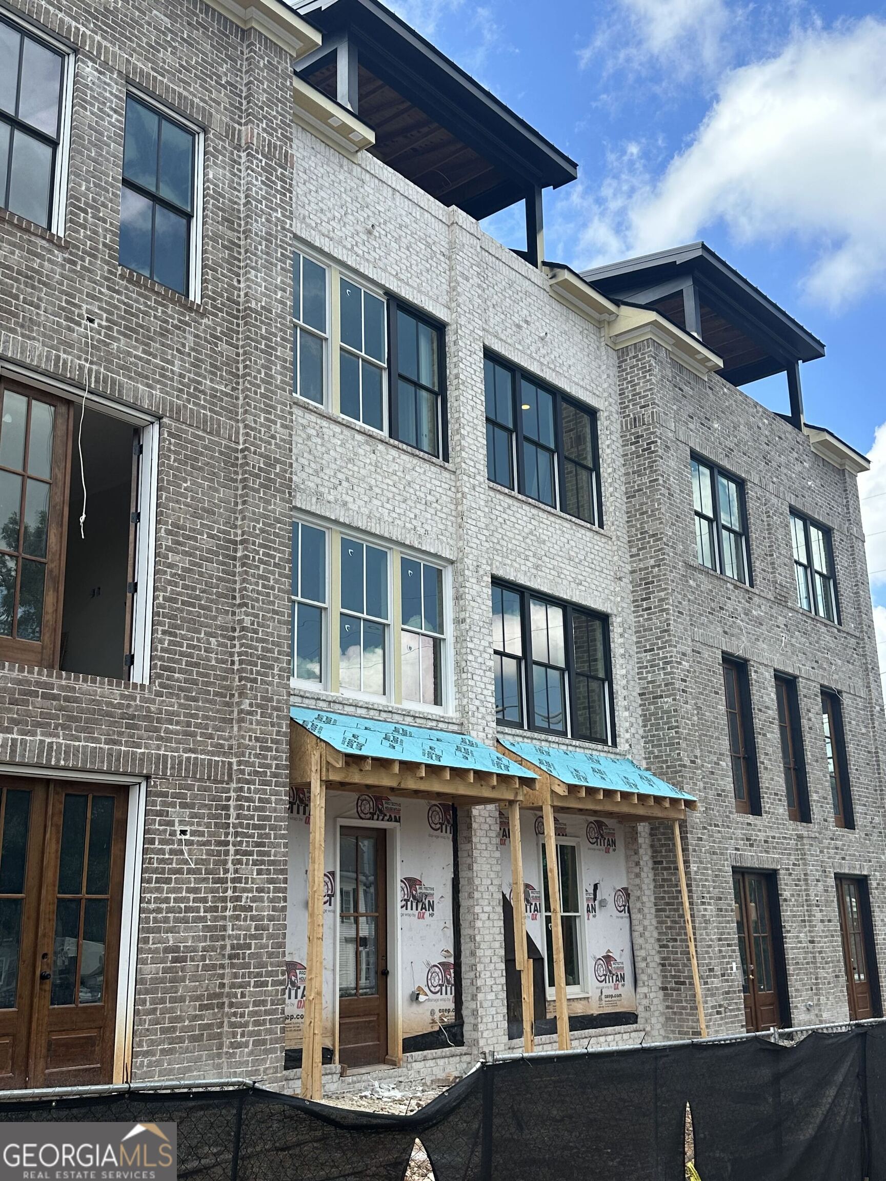 Discover the perfect blend of luxury and urban living at City Overlook Cartersville, where modern design meets convenience in the heart of downtown Cartersville. This quaint downtown was awarded with the Georgia Exceptional Main Street Designation! These stunning townhomes offer spectacular skyline views from private rooftop patios. Convenience is literally at your doorstep - step out and enjoy the charming local shops, vibrant dining options and engaging cultural attractions. Imagine the lifestyle of no maintenance, easy living! Your own private ELEVATOR makes living here a DREAM at any age or stage! And who wouldnCOt love enjoying the beloved Cartersville Christmas Parade from your own private rooftop patio?? Featuring 3 generously sized bedrooms and 3 and 1/2 baths, each unit is designed with high-end finishes that elevate your living experience. Abundant natural light floods the open-concept interiors, highlighting the sophisticated craftsmanship throughout. With plenty of storage options, these townhomes provide all the space you need for comfortable living. Embrace modern living with unparalleled views and an exceptional lifestyle at City Overlook. Schedule your private tour today and experience the best that downtown Cartersville has to offer!