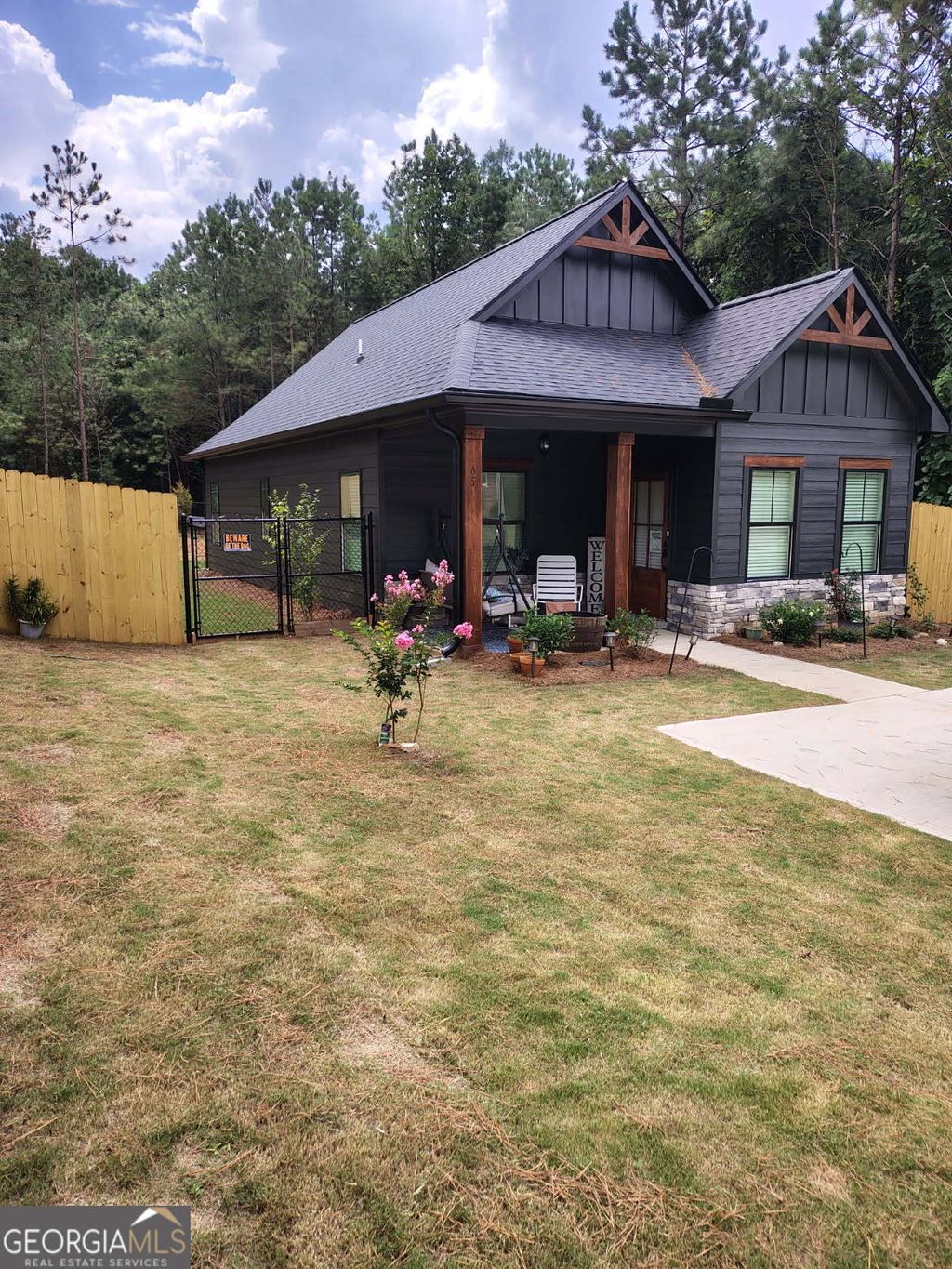 Photo of 65 Magnolia Street, Buchanan, GA 30113 (MLS # 10703477)